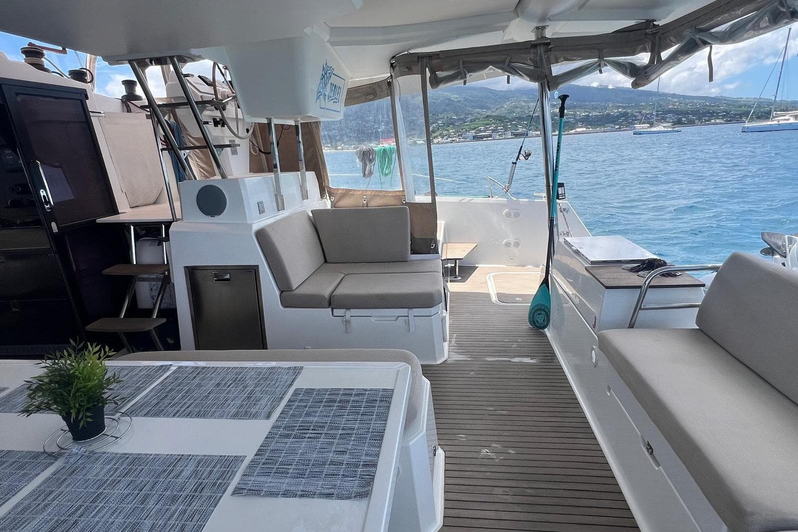 Spacious deck of 2022 Fountaine Pajot Elba 45 Catamaran with seating and ocean view.