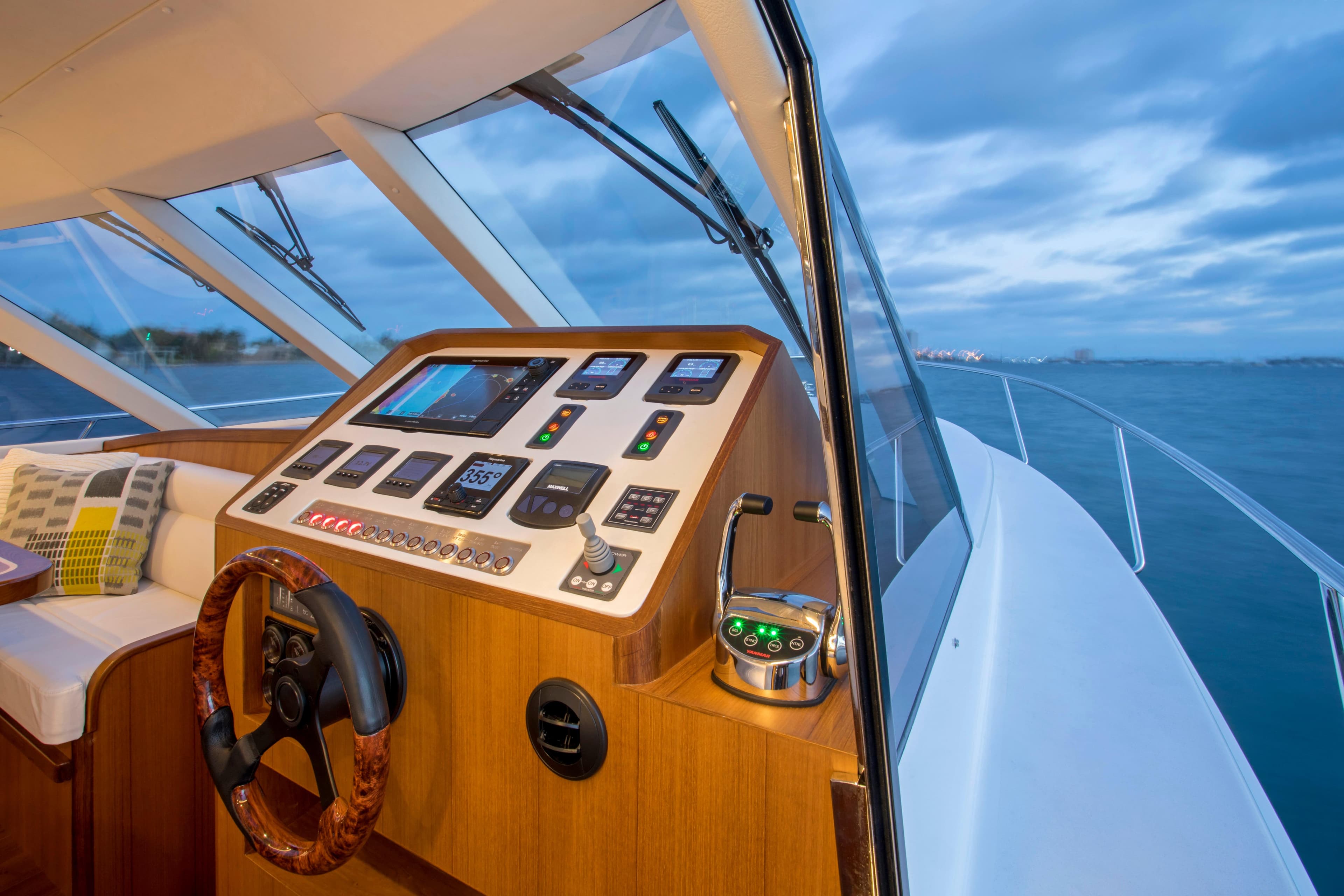 Helm of 2025 Hylas M49 yacht with modern navigation controls at sea.