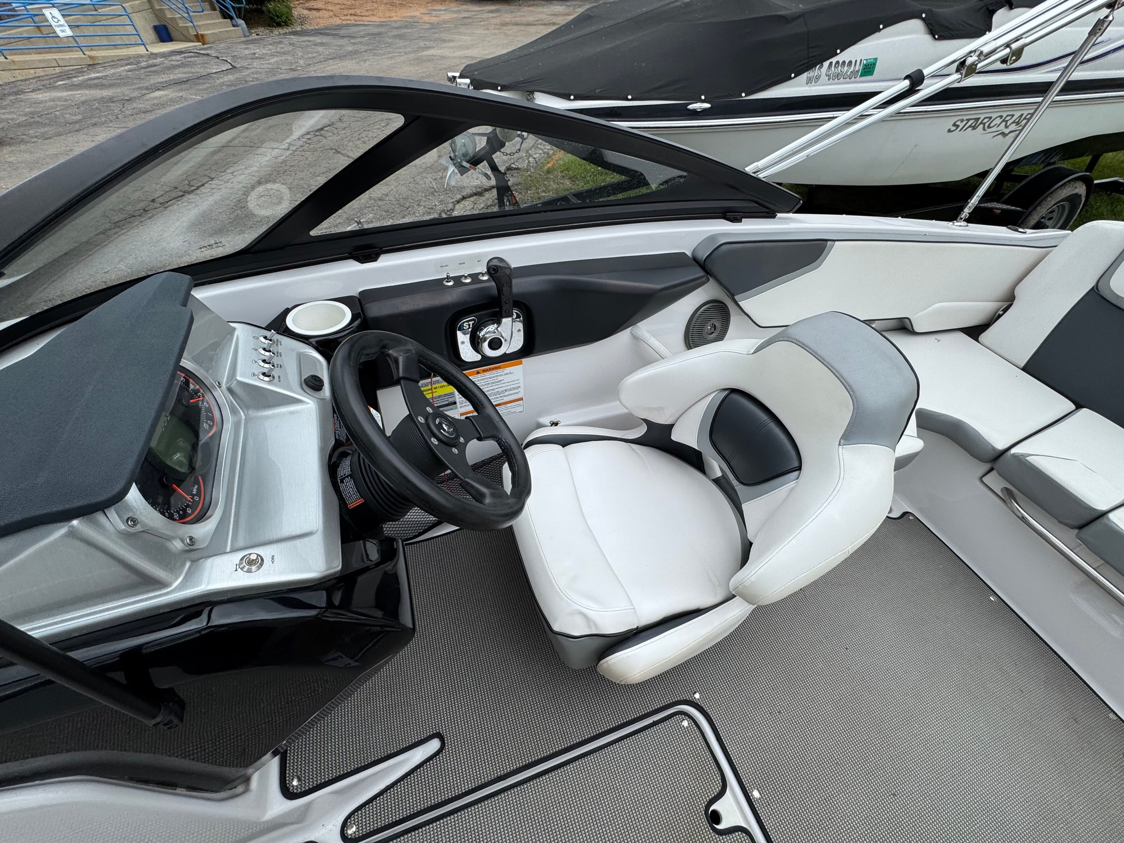 Interior of a 2017 Scarab SB 195 JET boat with steering console.