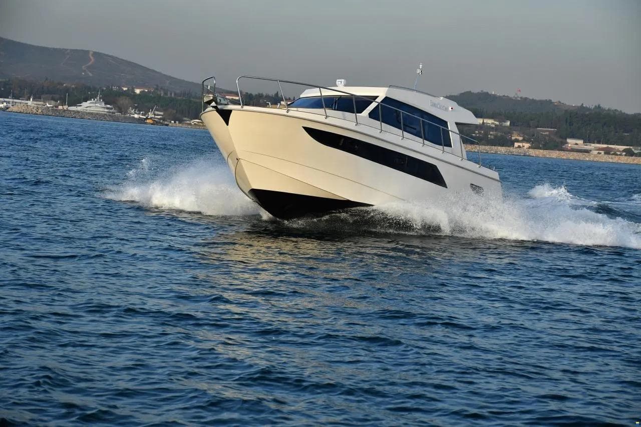 ERMAN YACHTING Comfort 36 cruising on open water, showcasing sleek design and performance.