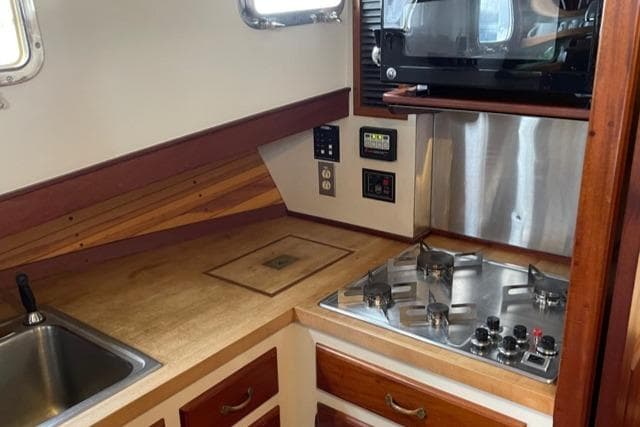 1988 Holland Wesmac-Foley Flybridge Cruiser kitchen area.
