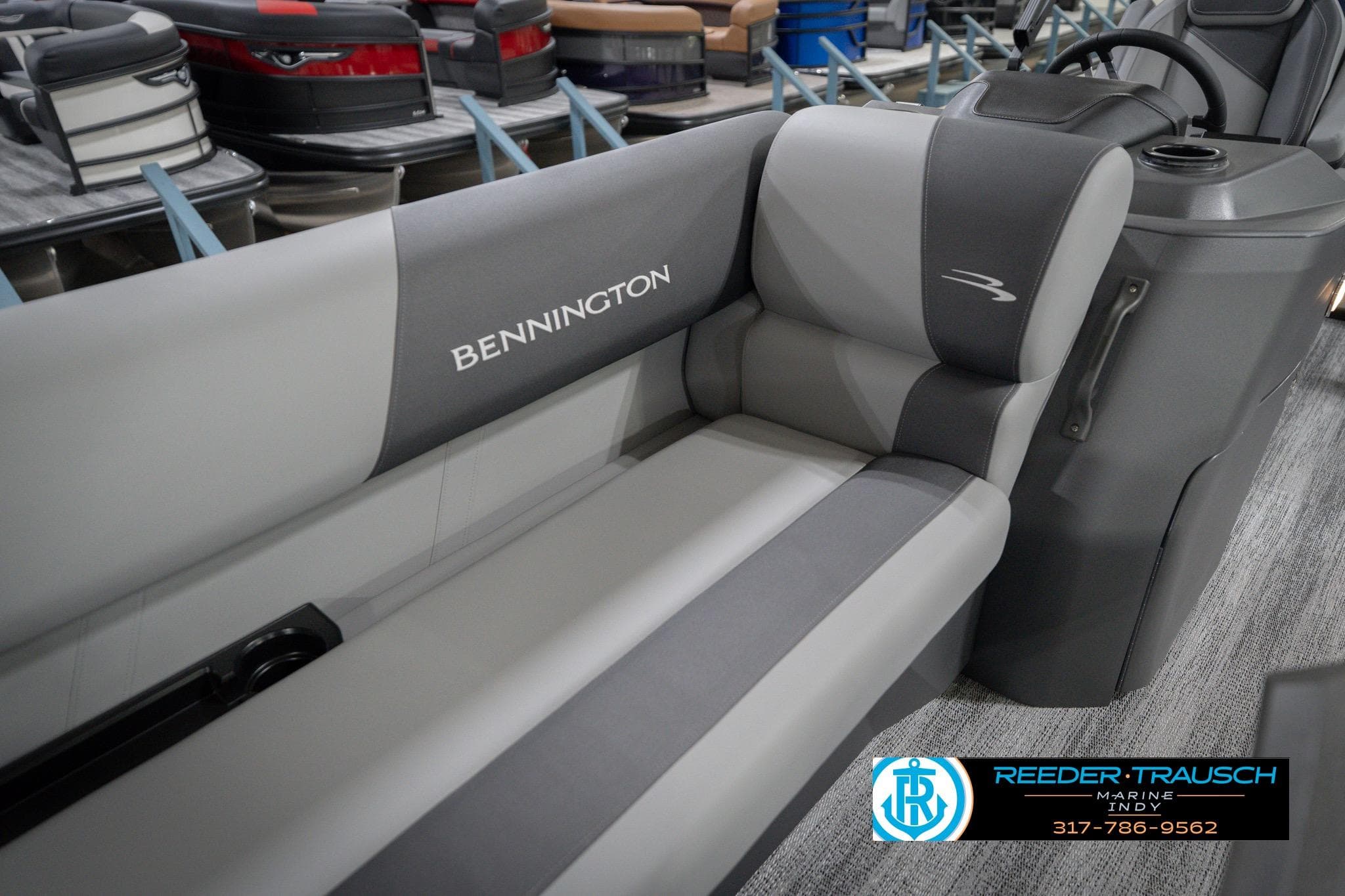 2026 Bennington 22 SSB boat interior with gray seating and console, displayed at Reeder-Trausch Marine.