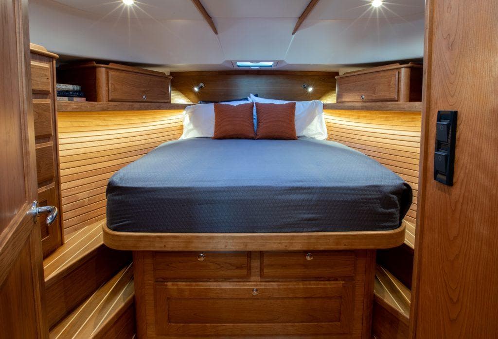 Luxurious cabin interior of 2026 Sabre 43 Salon Express yacht with wooden finishes.