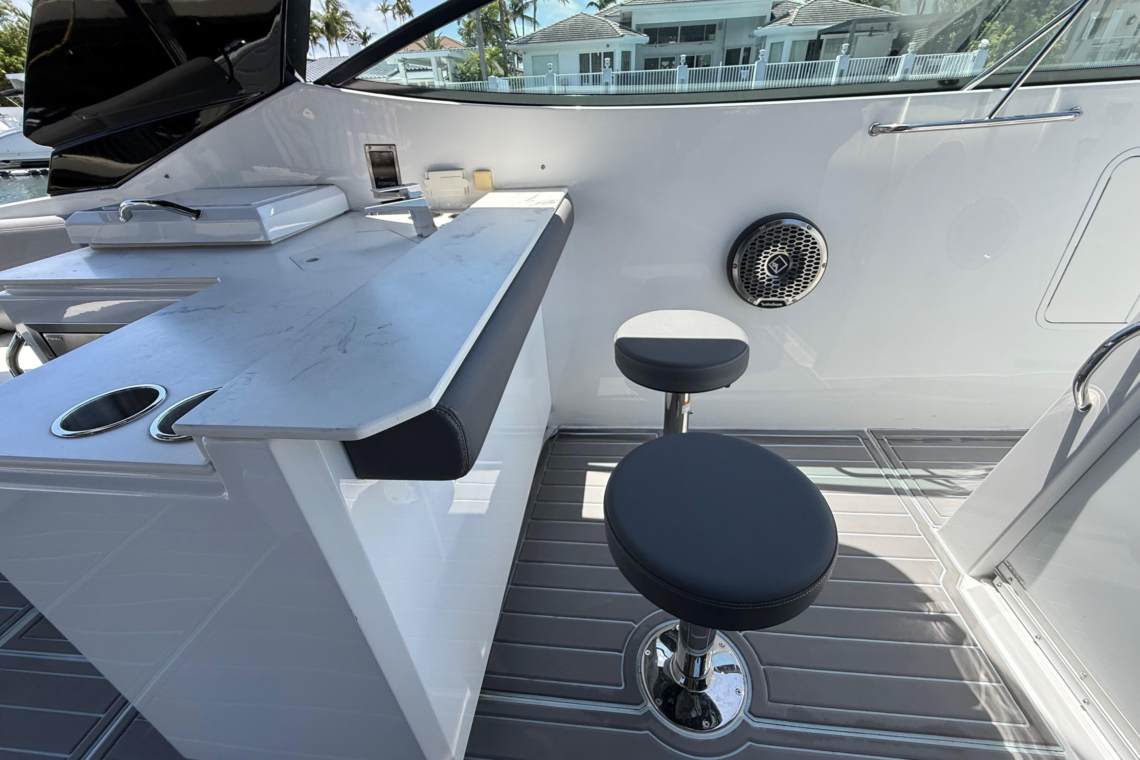 Interior of 2021 Cruisers Yachts 38 GLS OB with bar seating and modern design.