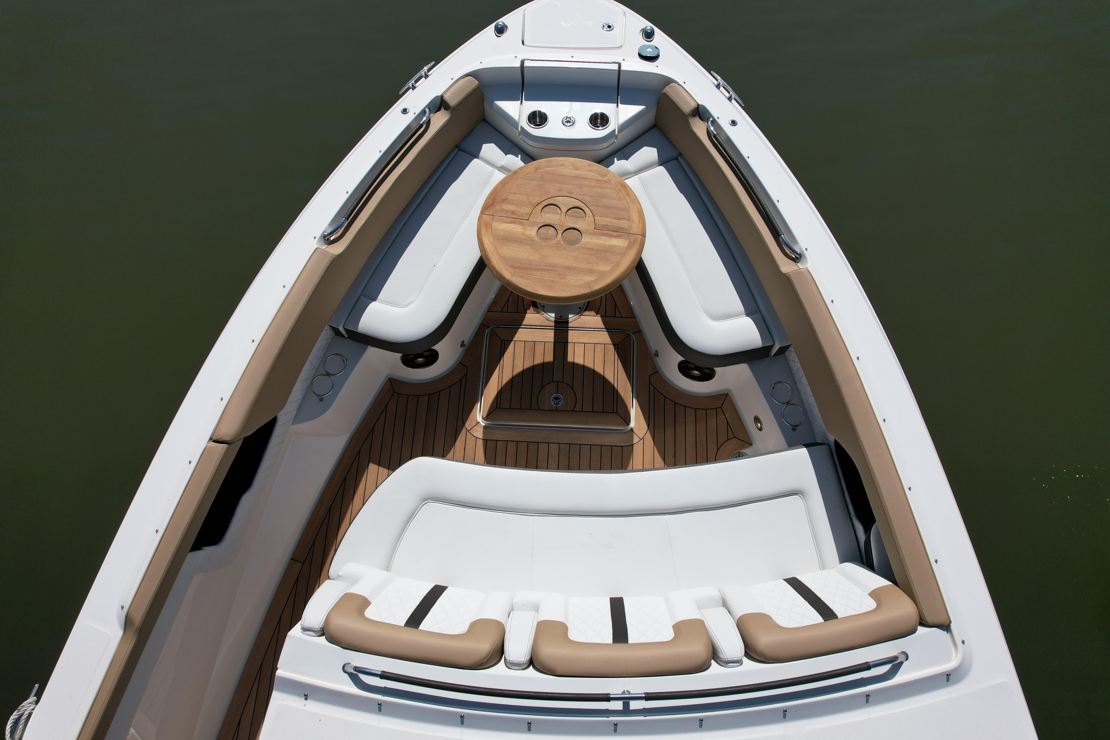 Luxurious 2019 Sea Ray SLX 400 boat interior with elegant seating and wooden table.