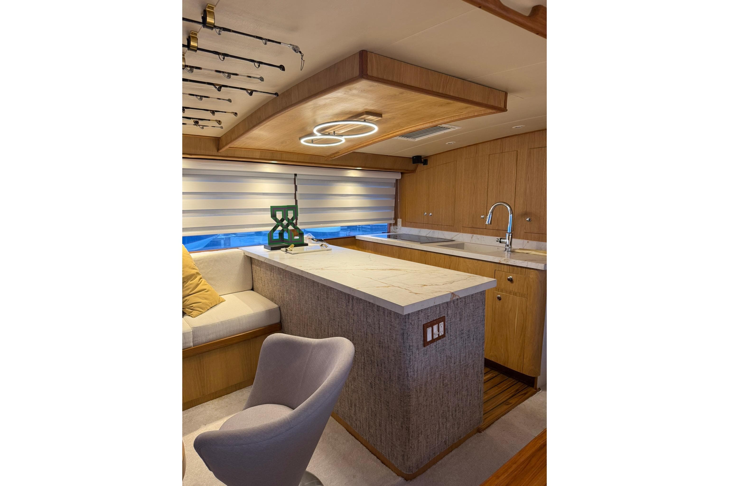 Luxurious interior of a 1989 Buddy Davis 61 yacht with modern kitchen and seating area.