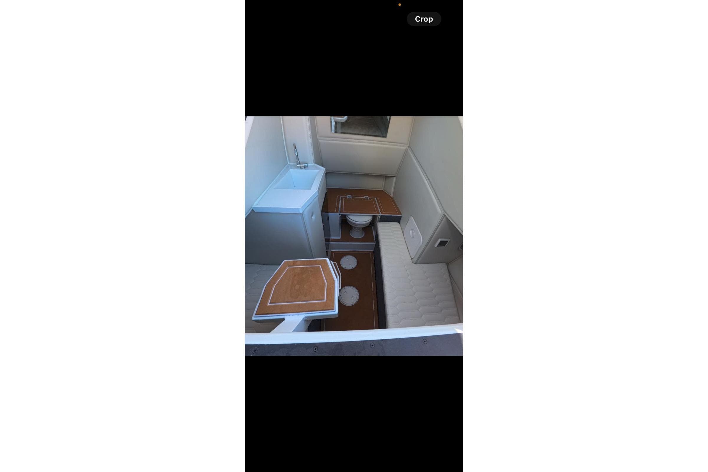 Interior of 2026 Novielli Veloche 349 boat with seating and sink.