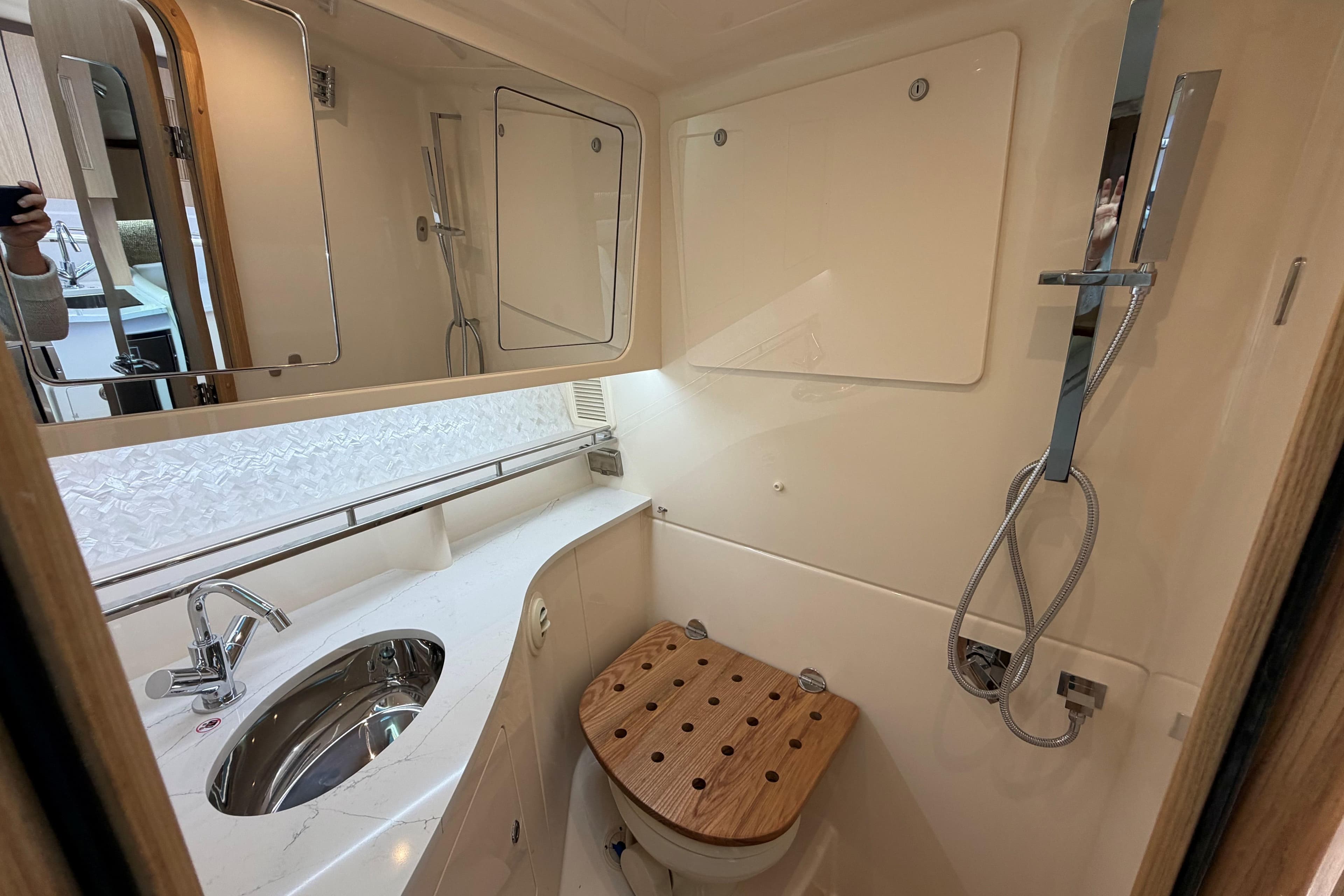Luxurious bathroom in 2026 Grady-White Express 340 boat with modern fixtures.