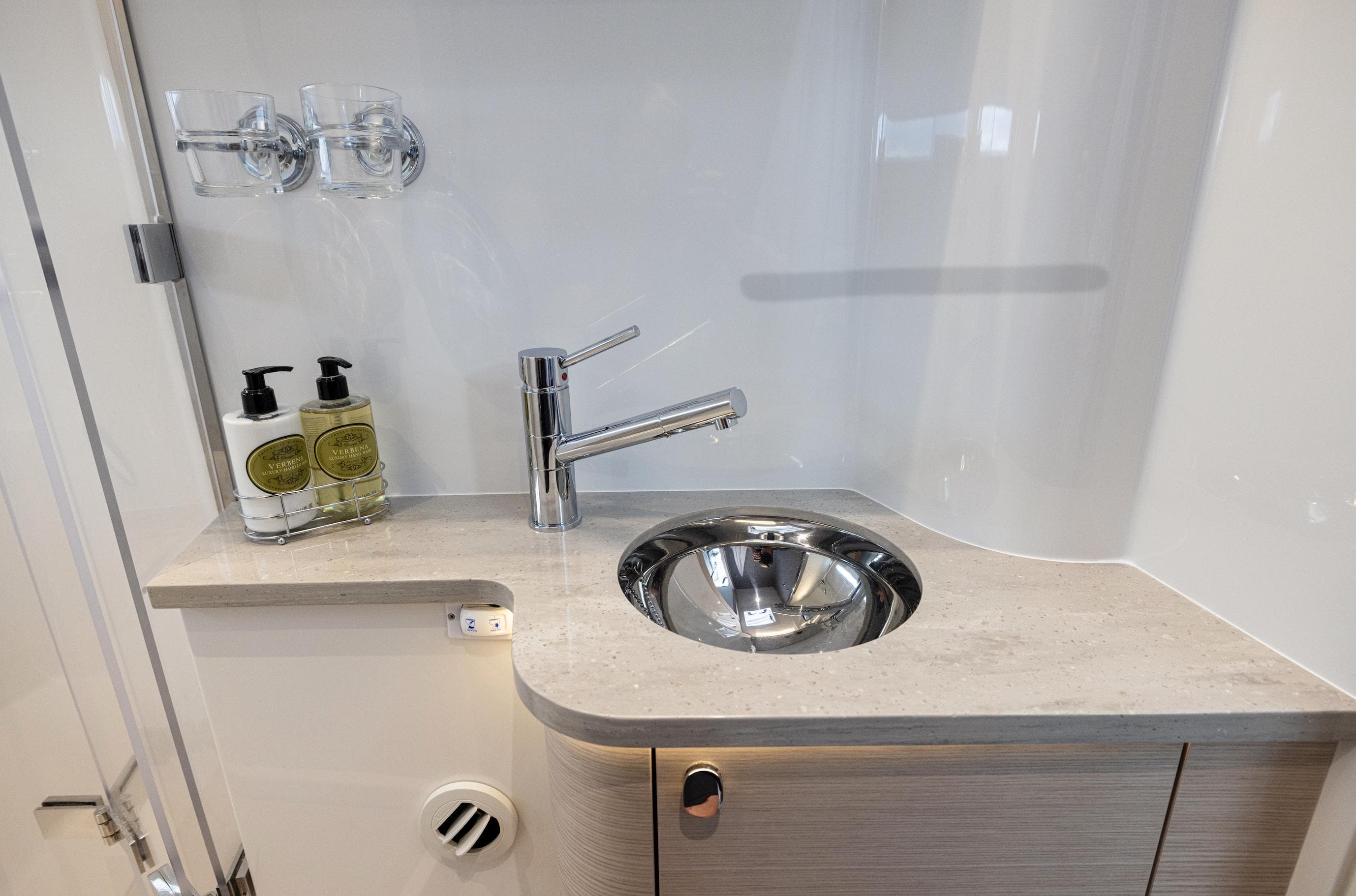 Modern bathroom sink in 2025 Nimbus 495 Flybridge yacht, featuring sleek design and luxury amenities.