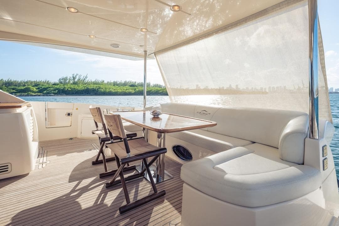 Luxurious 2012 Azimut Evolution yacht deck with seating and scenic water view.