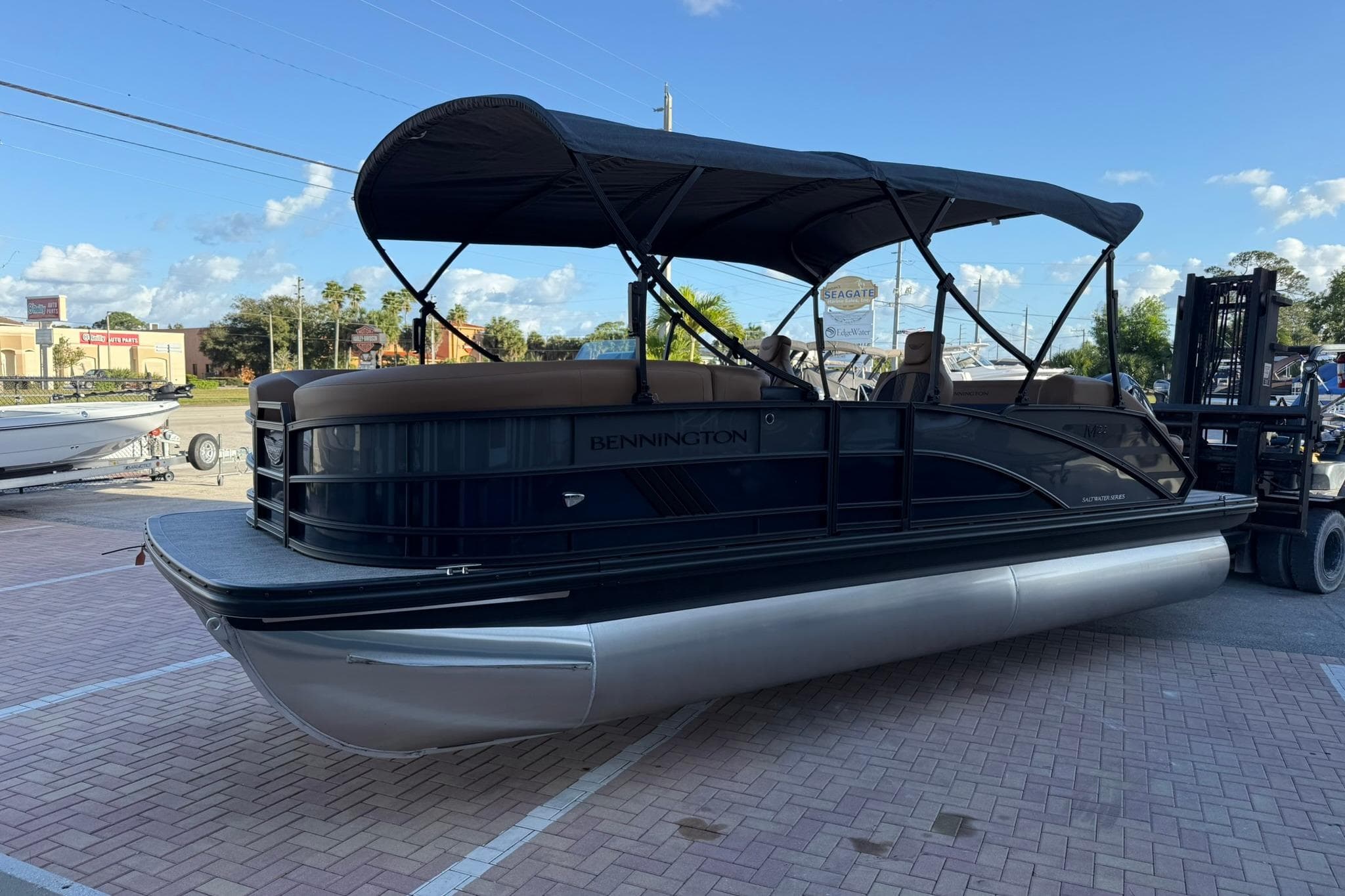 2026 Bennington 22 M Swingback pontoon boat with canopy on display.