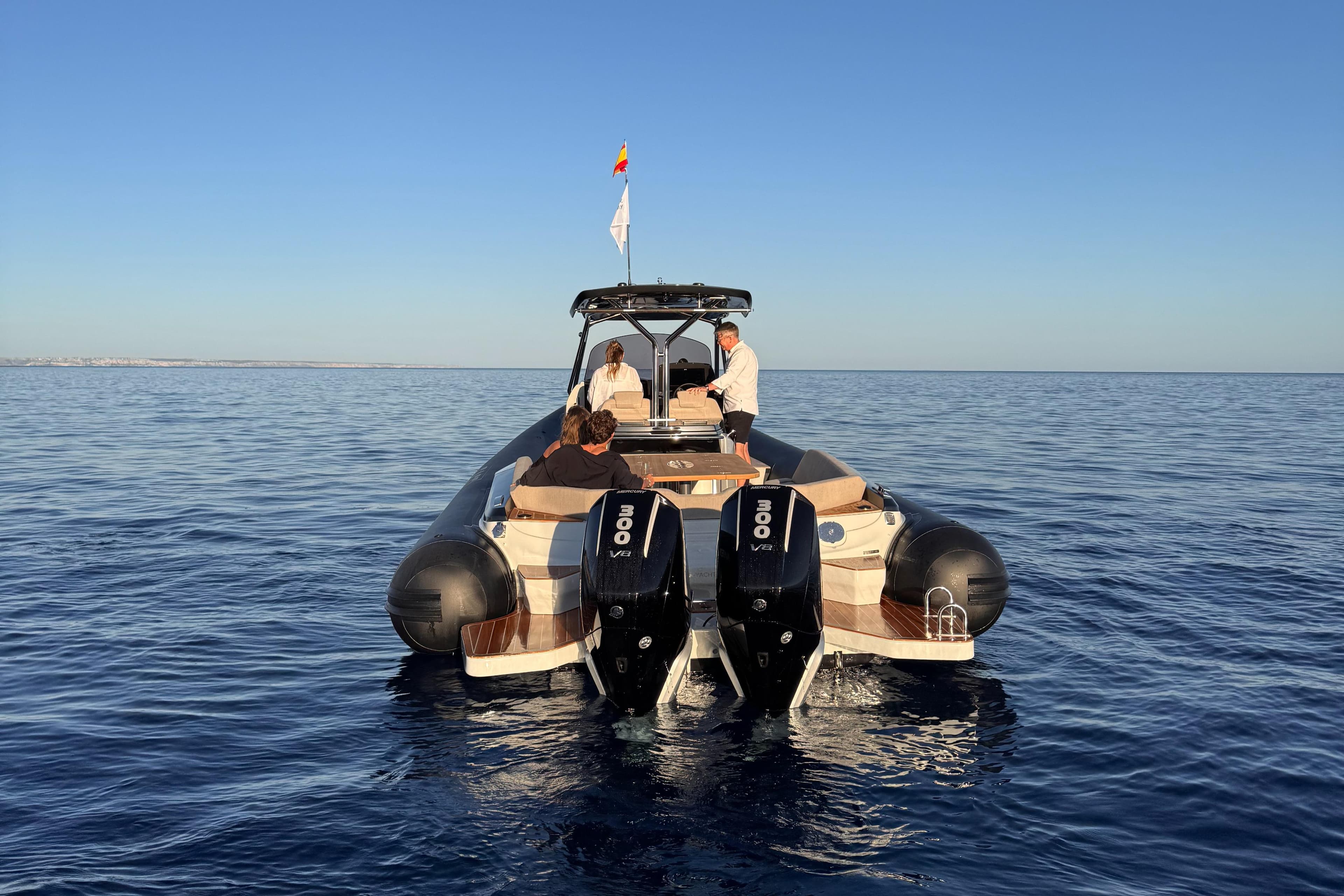 2025 SACS Strider 11 OB Sundeck cruising on calm ocean waters.