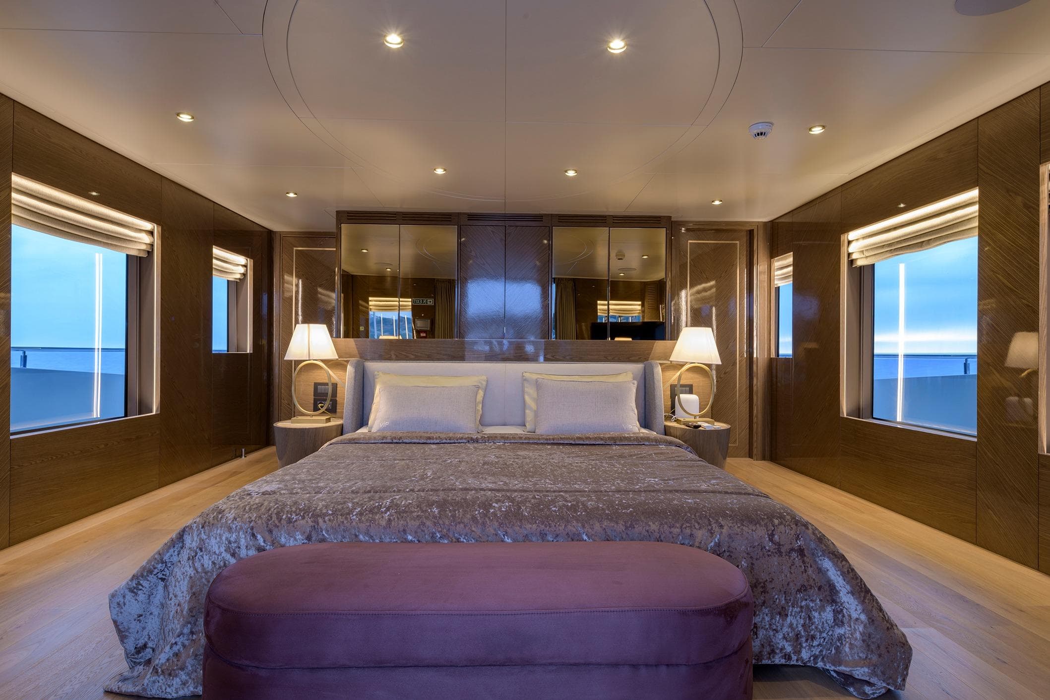 Luxurious bedroom interior on Blaundus V30 Explorer yacht, 2023 model, with elegant lighting and ocean views.