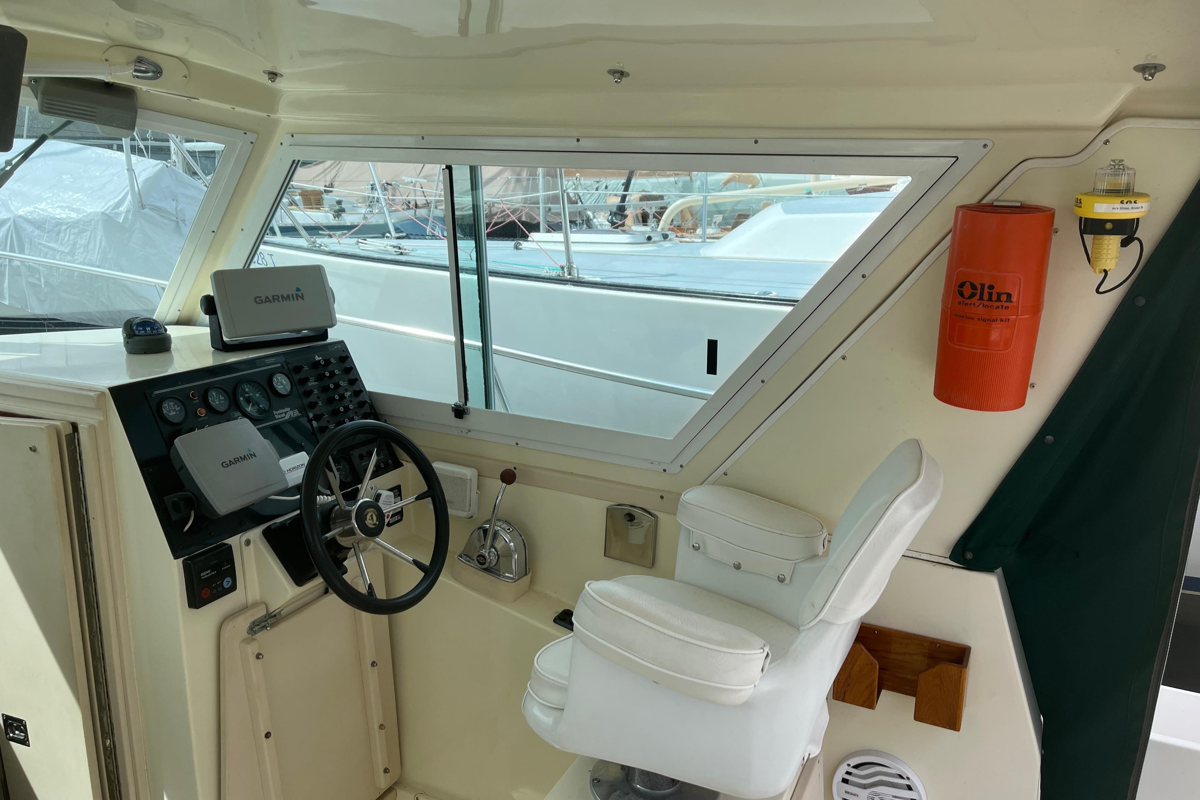 Interior helm of 1998 Albin 28 Tournament Express with Garmin navigation system.