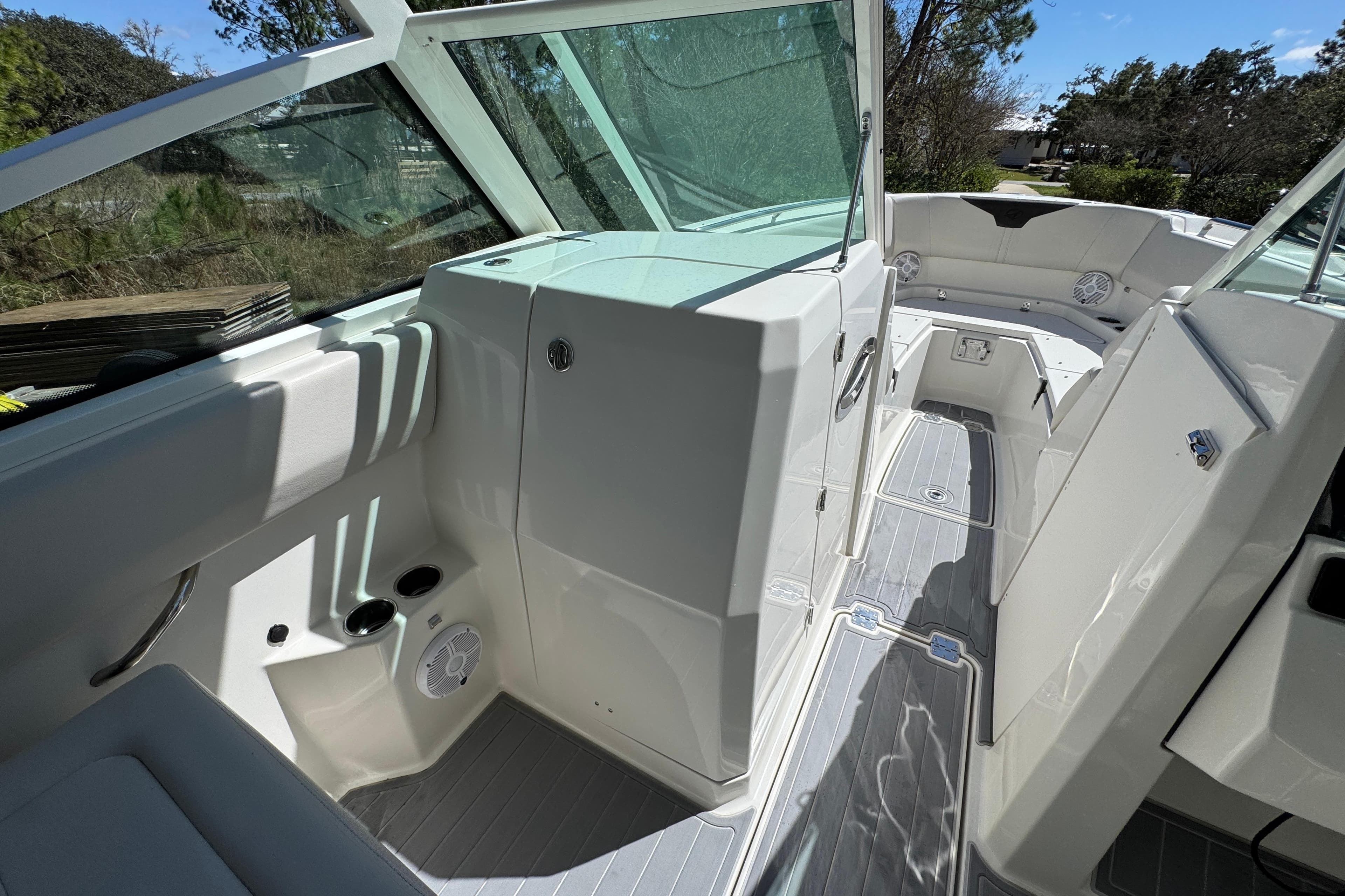 2022 Sailfish 276 DC boat interior with seating and cup holders.