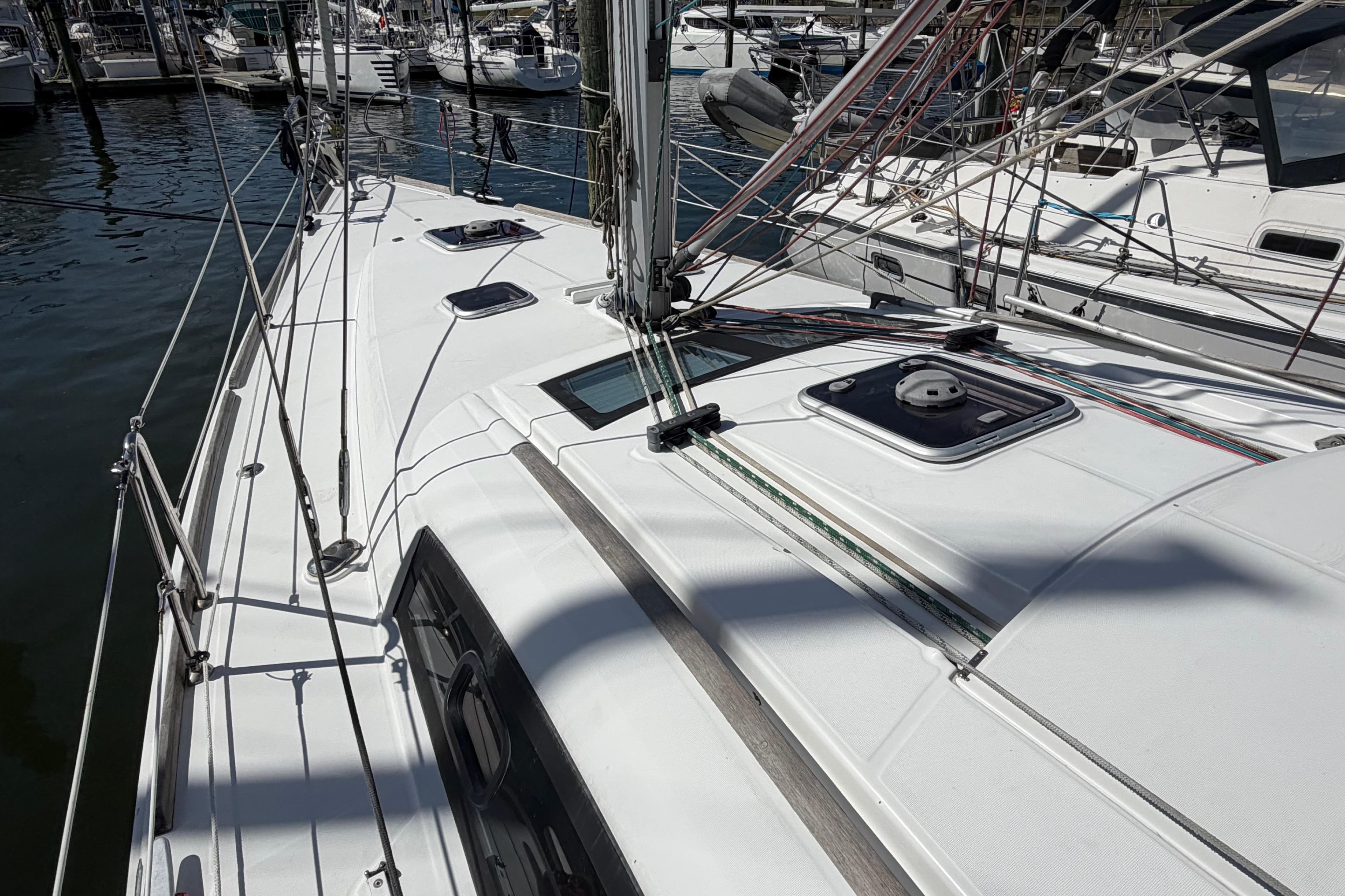 Deck view of a 2008 Beneteau 43 sailboat in a marina.