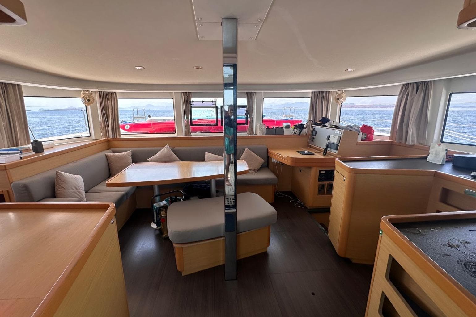 Interior of 2018 Lagoon 42 catamaran with spacious seating and ocean view.