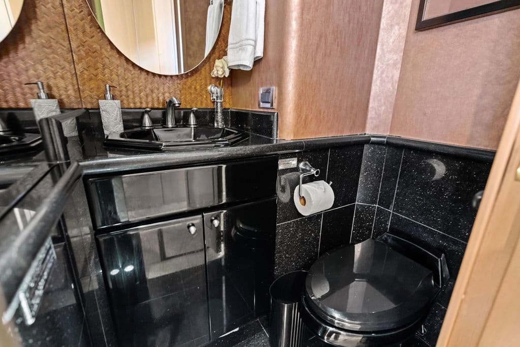 Luxurious bathroom in a 1999 Westport 112 yacht model.