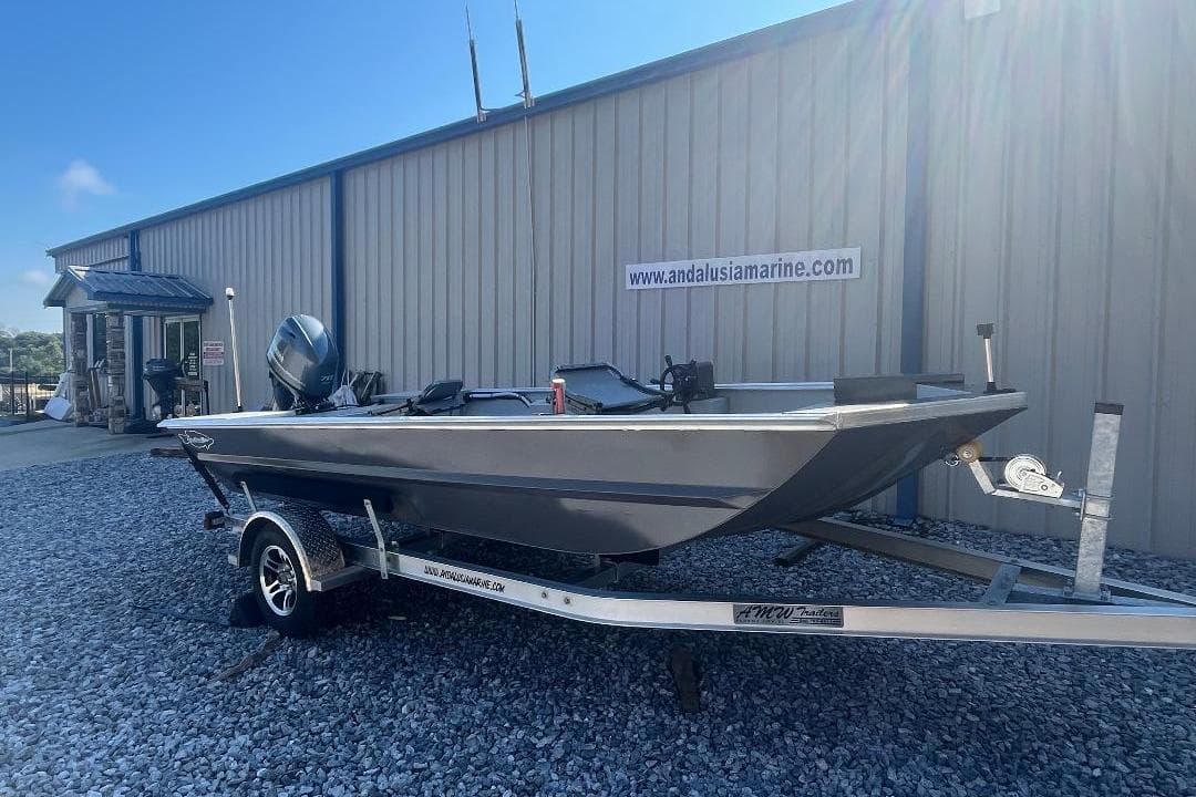 Custom 1660 PF boat on trailer outside Andalusia Marine, 2026 model.