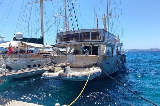 Aganlar Custom Built Gulet 34M, 2009, docked in clear blue waters.
