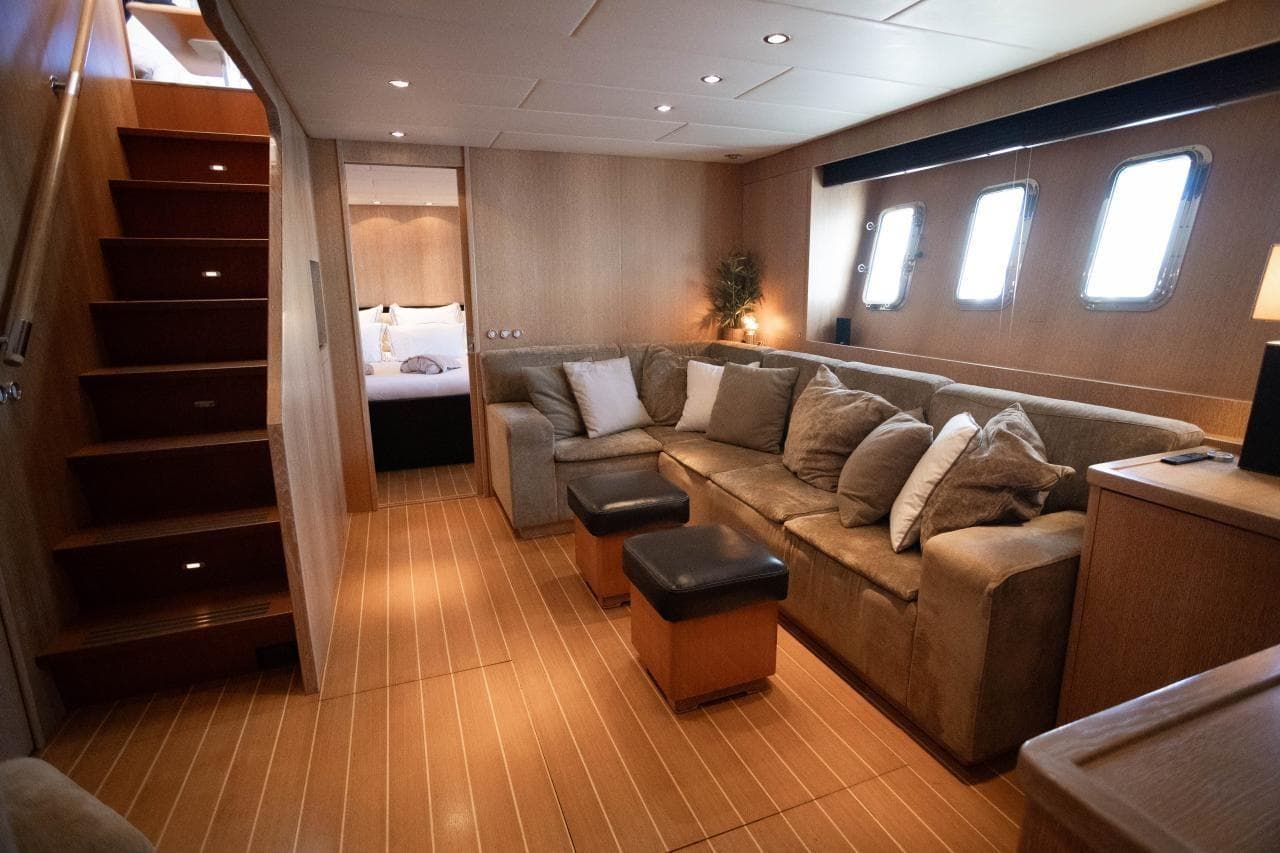Luxurious interior of 2005 Leopard 24 yacht with cozy seating and elegant decor.