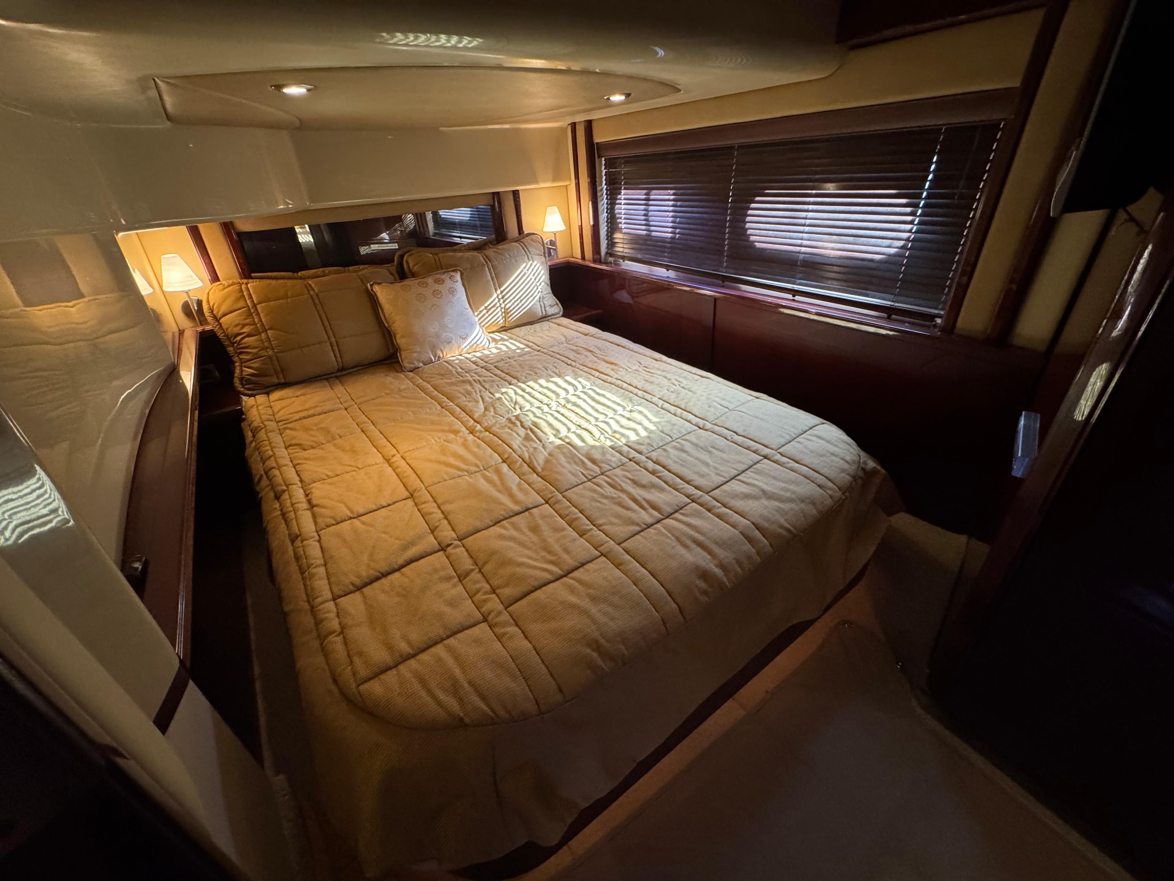 Luxurious bedroom interior of 2007 Sea Ray 52 Sedan Bridge yacht.