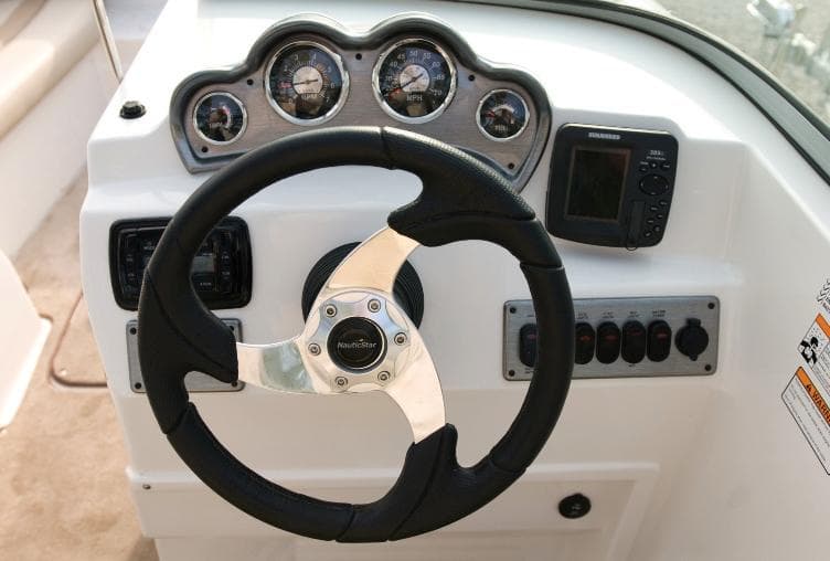 Manufacturer Provided Image: Steering console of 2014 NauticStar 203SC Sport Deck boat with gauges and controls.