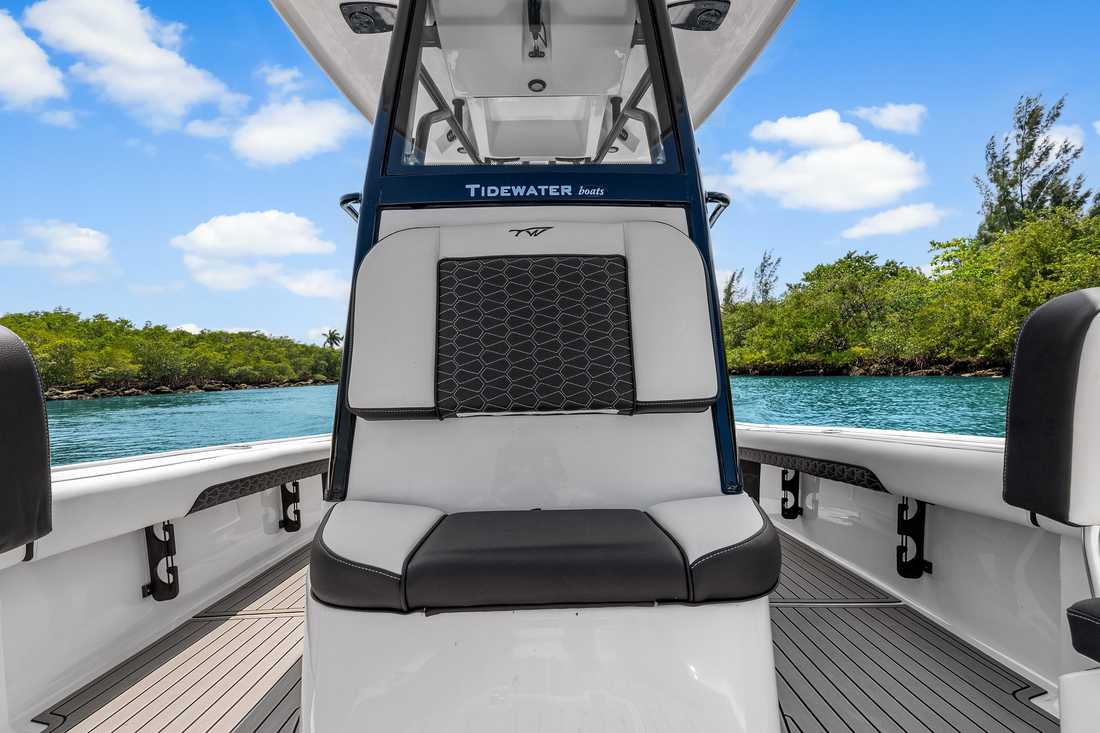 2026 Tidewater 2500 Carolina Bay boat interior with scenic water and greenery backdrop.