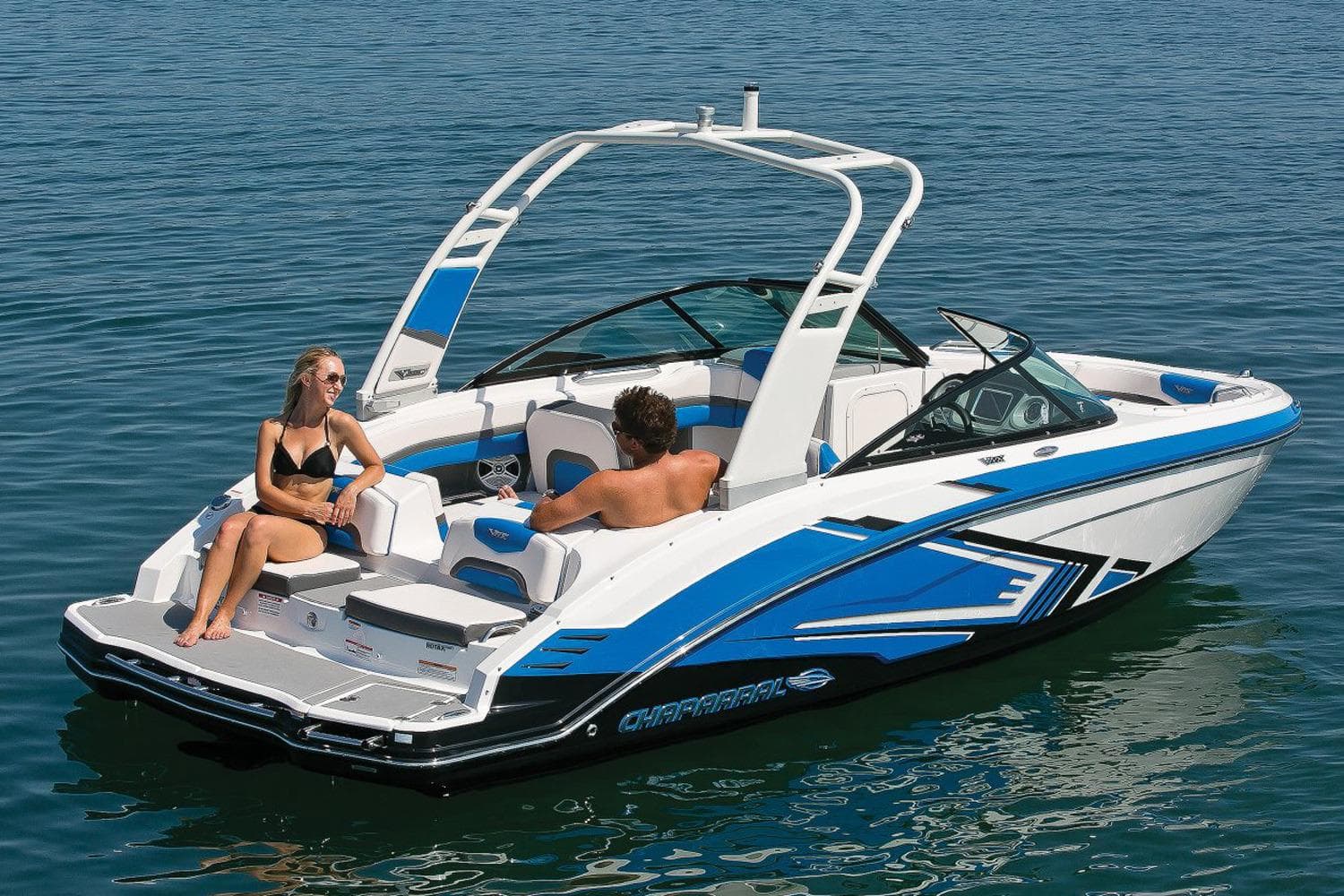 Manufacturer Provided Image: 2018 Chaparral Vortex 203 VRX boat on water with two people relaxing.
