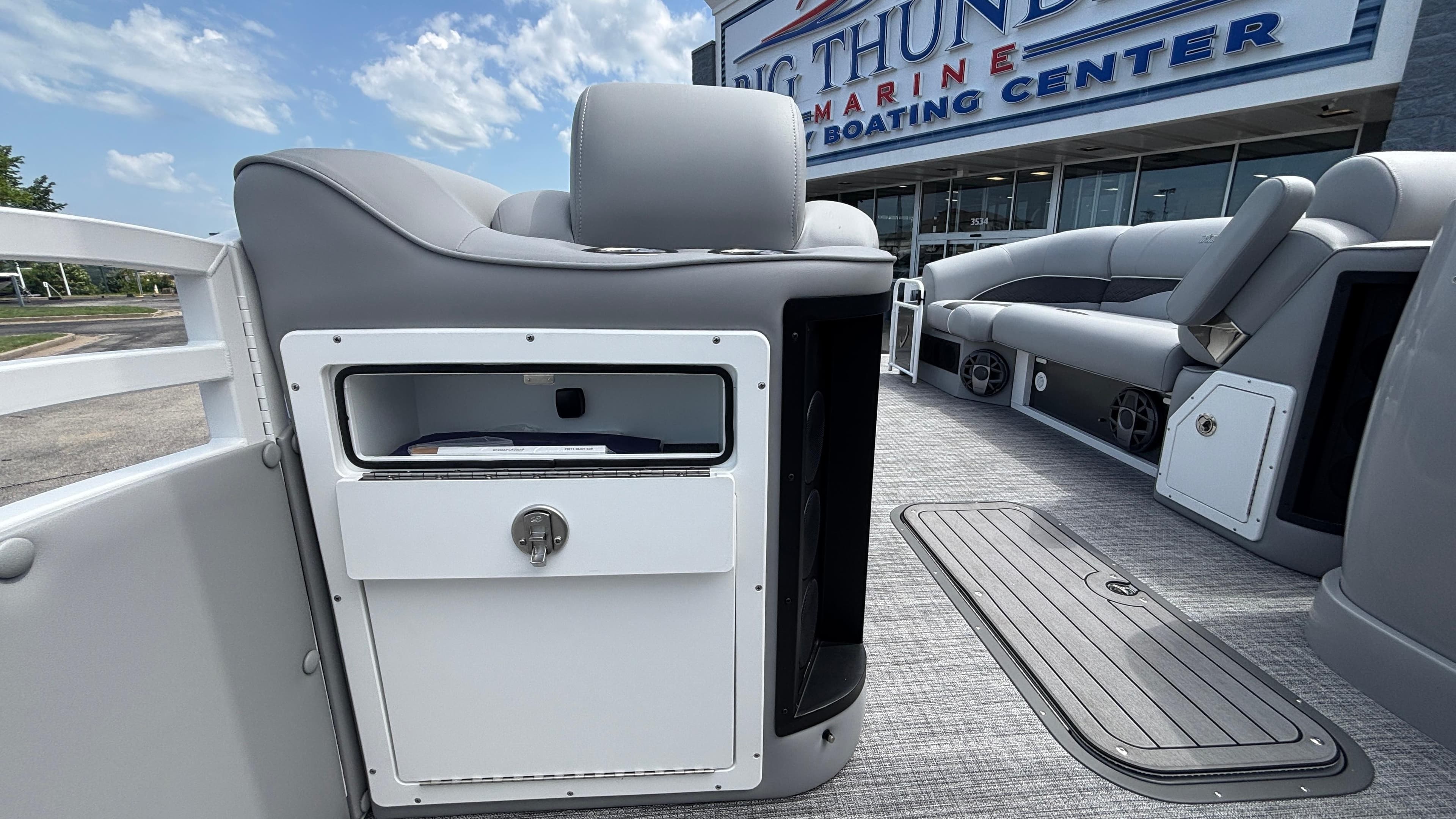 2025 JC Neptoon 25TT Sport pontoon boat interior with seating and storage compartments.