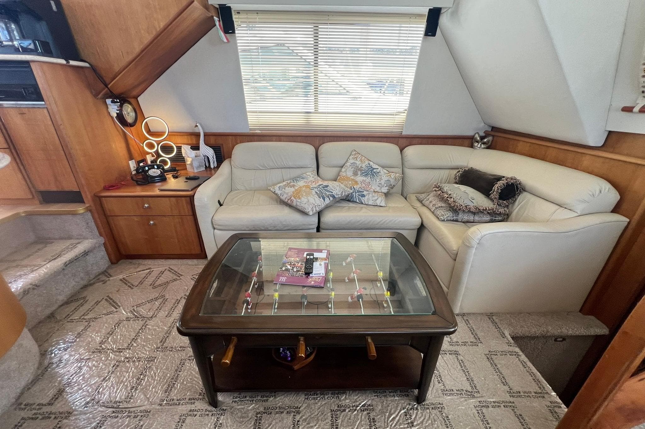 Luxurious interior of a 2000 Silverton 453 Motor Yacht with plush seating and elegant decor.