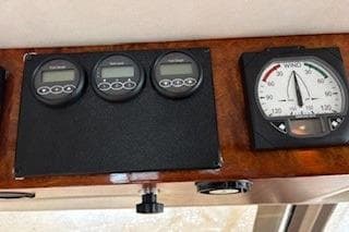 Control panel of 2000 Storebro Royal Cruiser 395 with gauges and wind indicator.