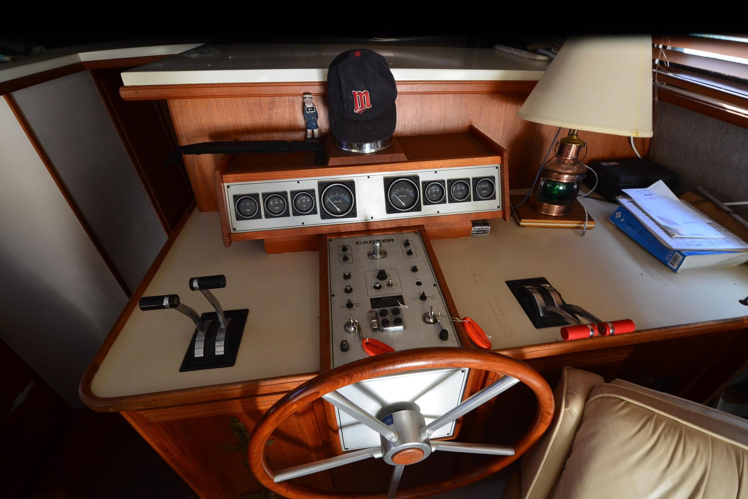 1986 Carver Cockpit 4227 MY boat helm with controls, gauges, and steering wheel.