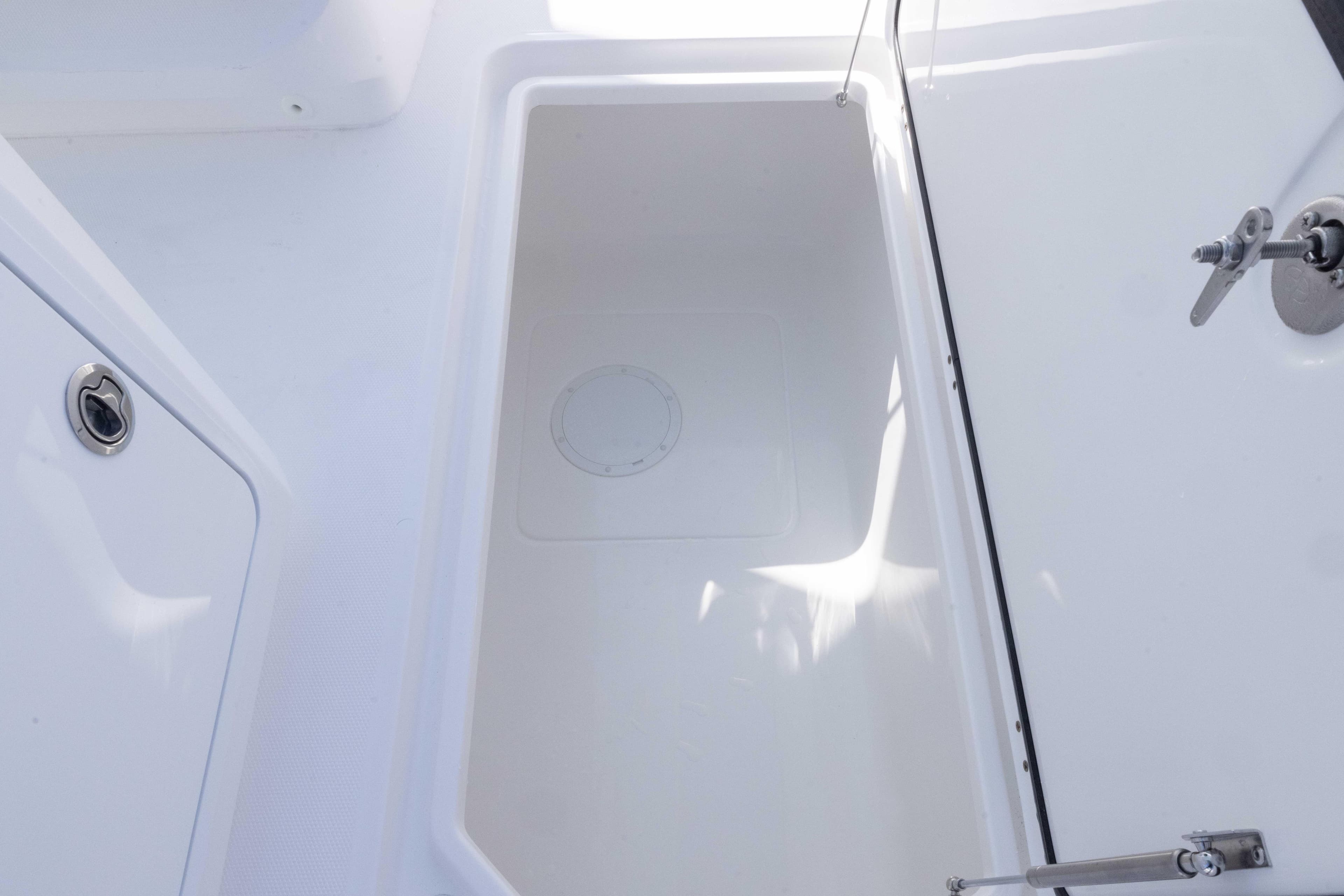 2025 Invincible 35 Catamaran storage compartment with sleek white interior design.