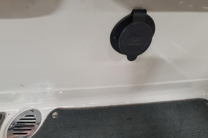 2009 MasterCraft X-45 boat detail showing a black cover and vent on white surface.