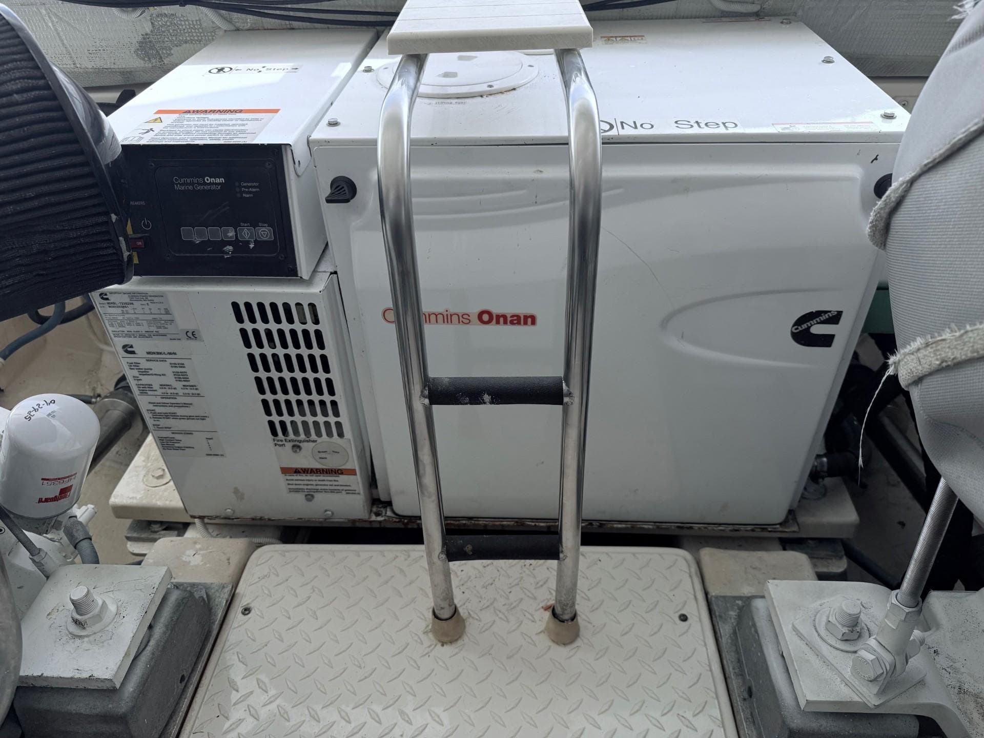 Cummins Onan generator on 2009 Tiara Yachts 39 Open, with metal ladder and platform.