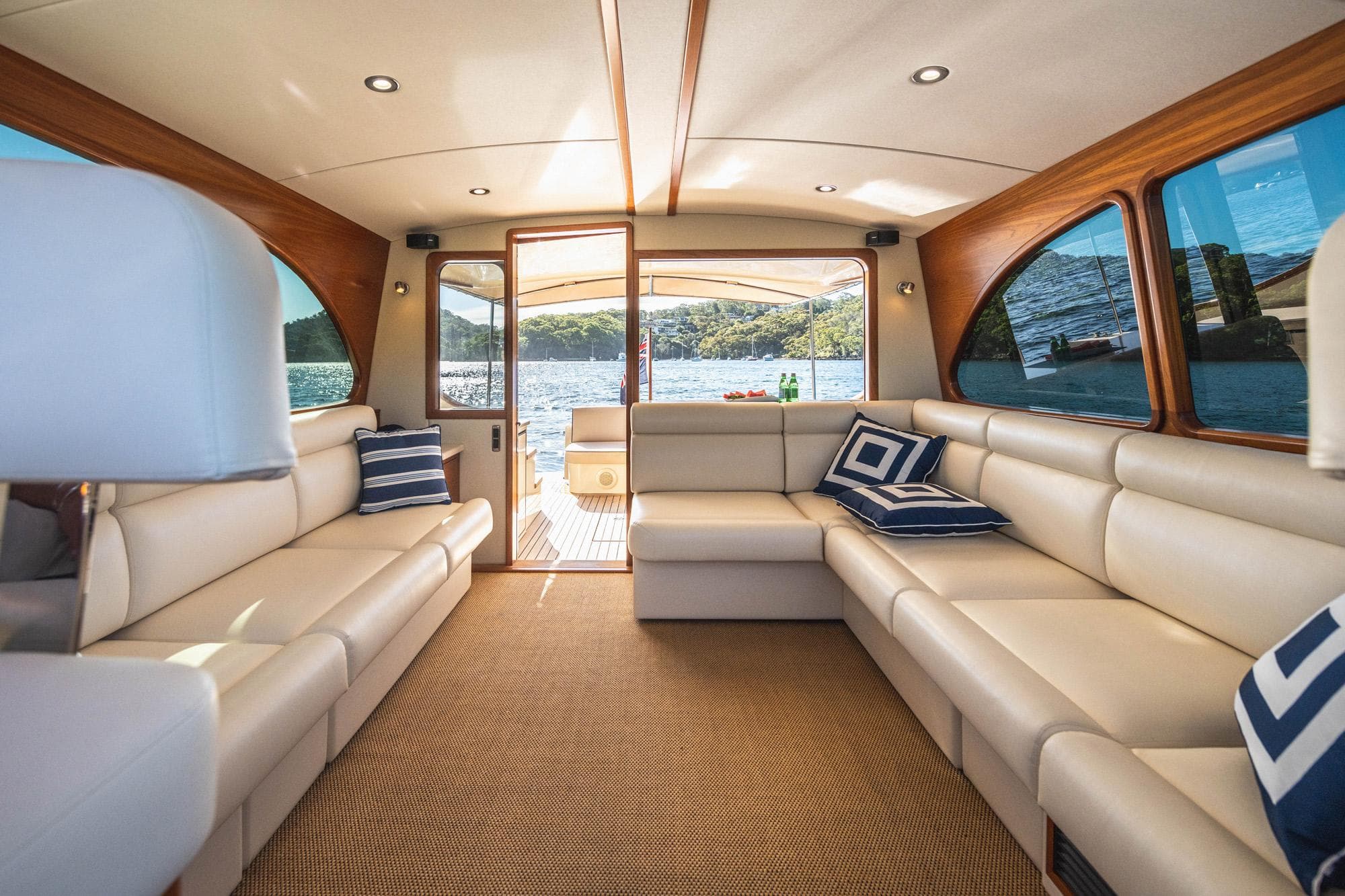 Luxurious interior of 2026 Palm Beach Motor Yachts PB45 with elegant seating and scenic water view.