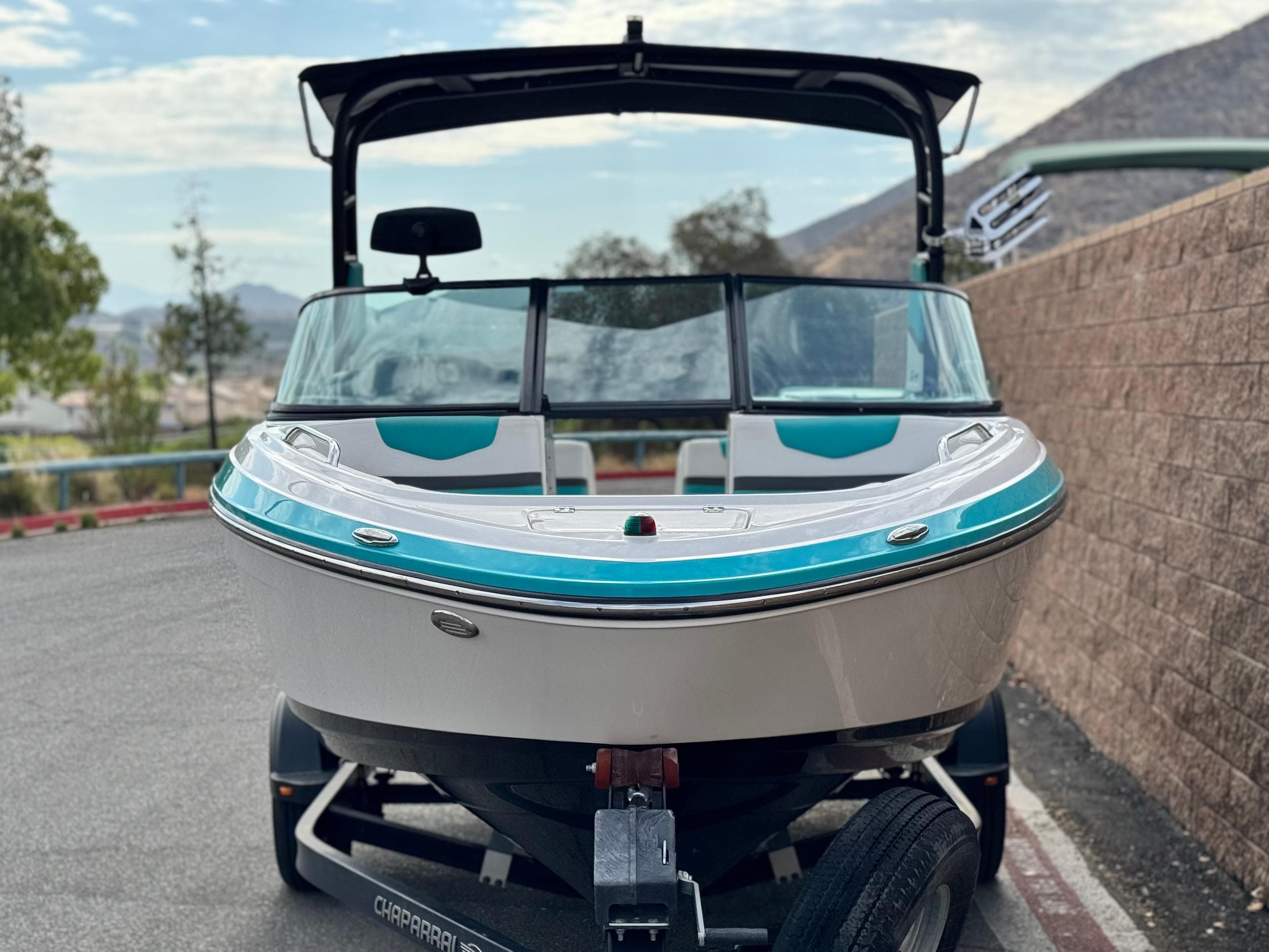 2015 Chaparral Vortex 203 VRX boat on trailer, front view, outdoors.
