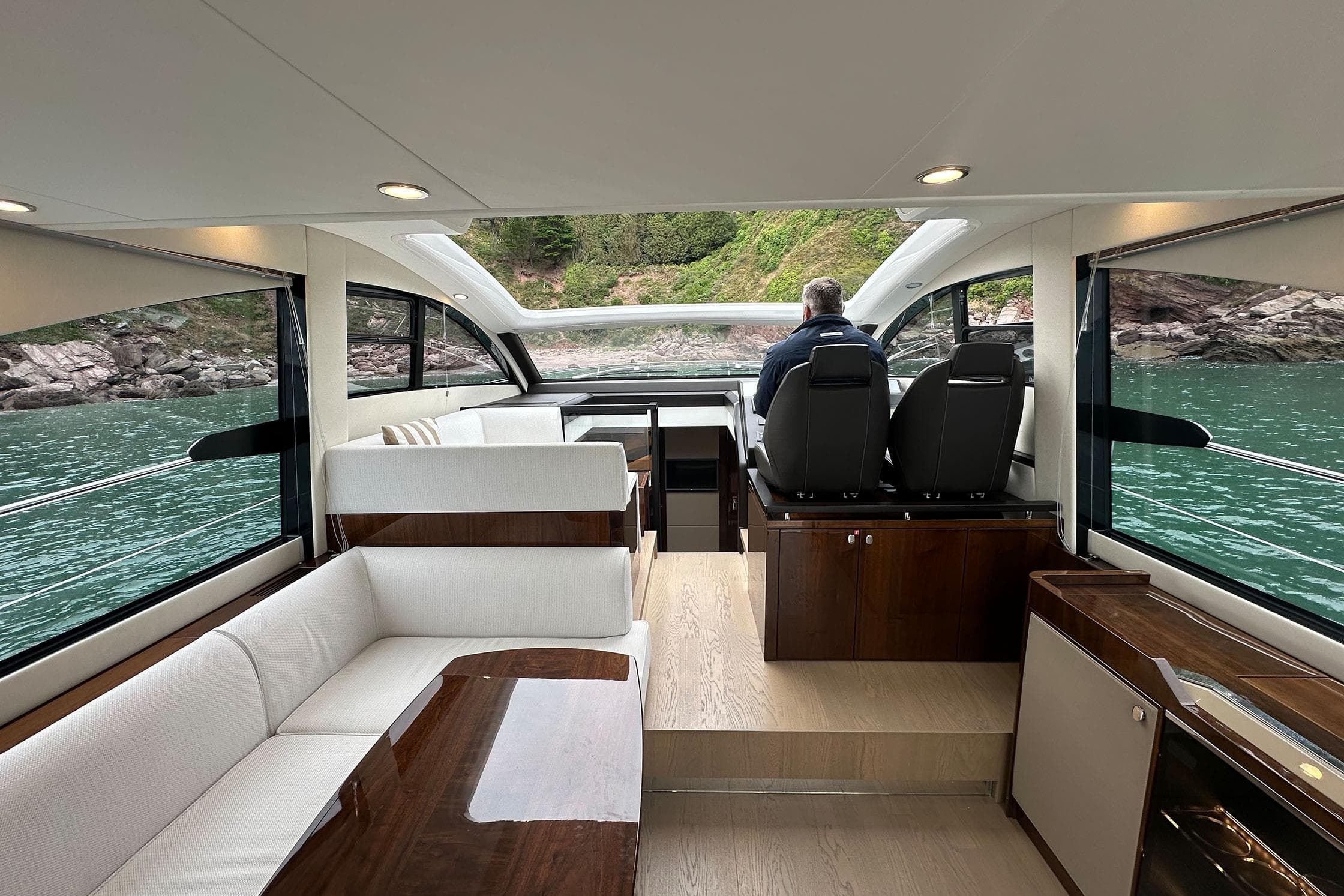 Interior of 2022 Fairline Targa 50 GT yacht with scenic water view.