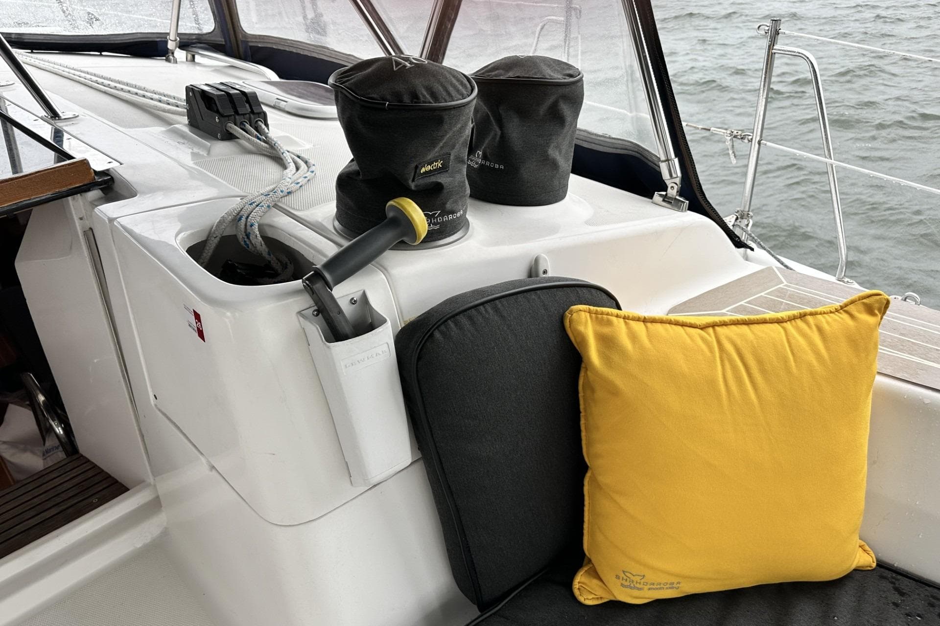 Sailboat cockpit with ropes, winches, and cushions on a Hunter 466, 2002 model.
