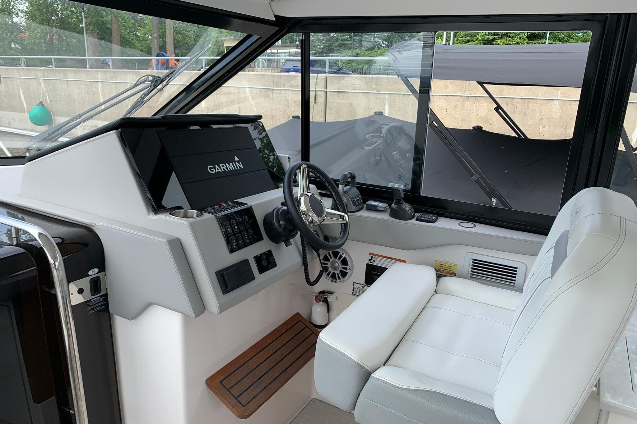 Cockpit of 2022 Regal 36 Grande Coupe with Garmin navigation system.