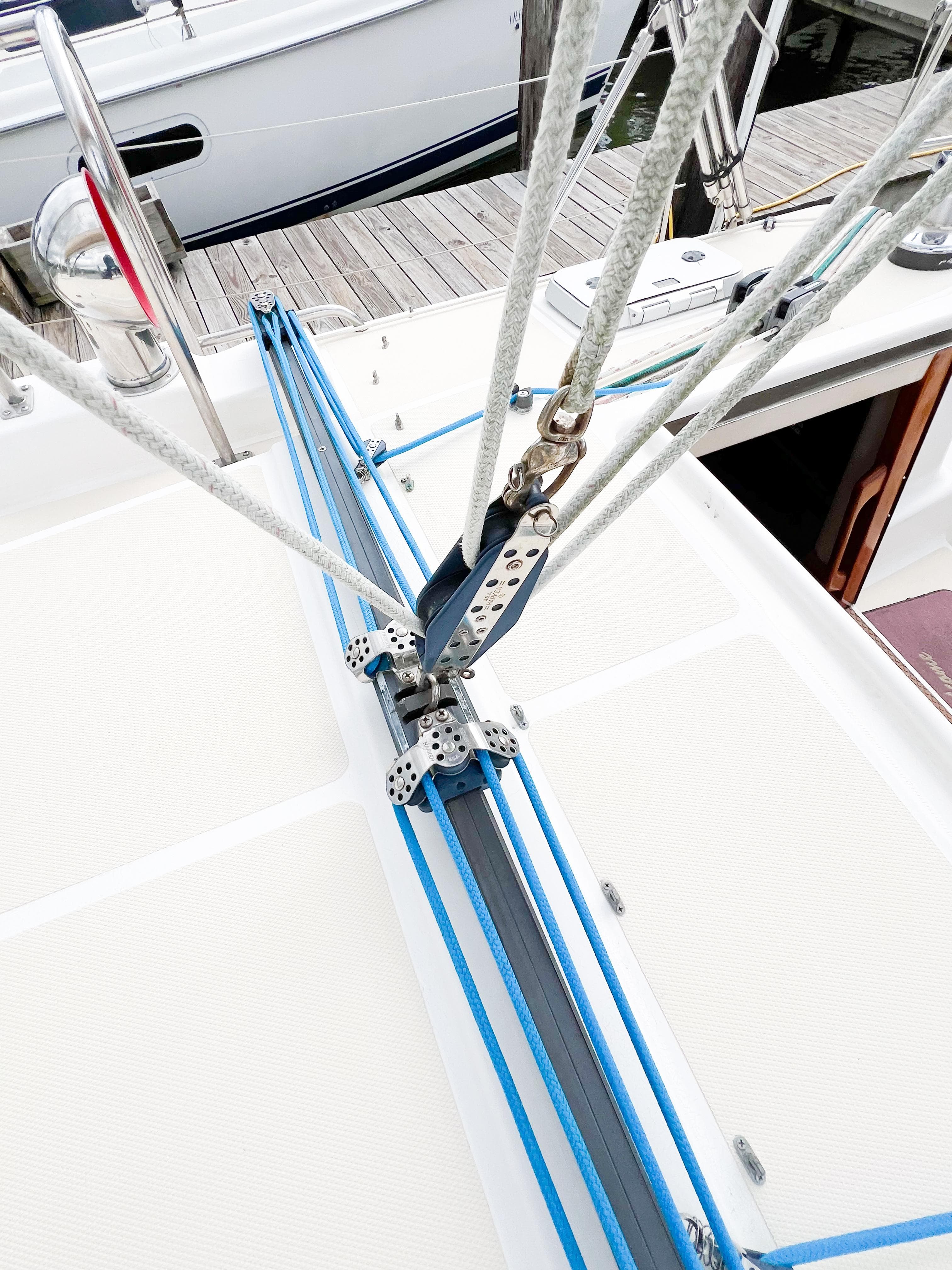 Sailboat deck with rigging, Saga 43 model, 1998, docked at marina.