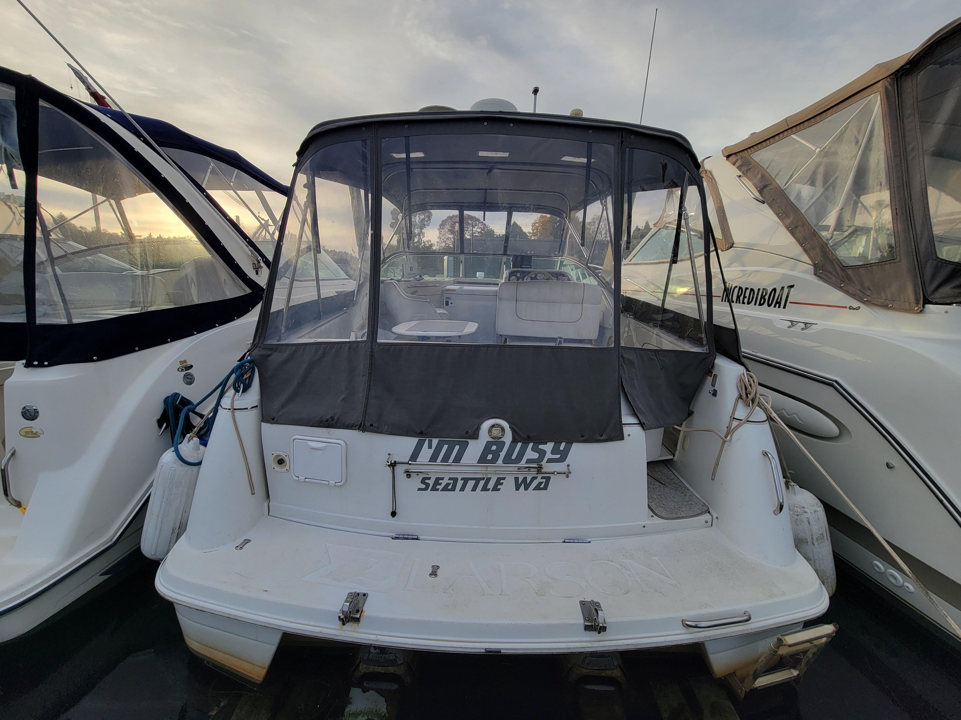 1997 Larson 290 Cabrio boat docked, rear view with canopy, Seattle, WA.