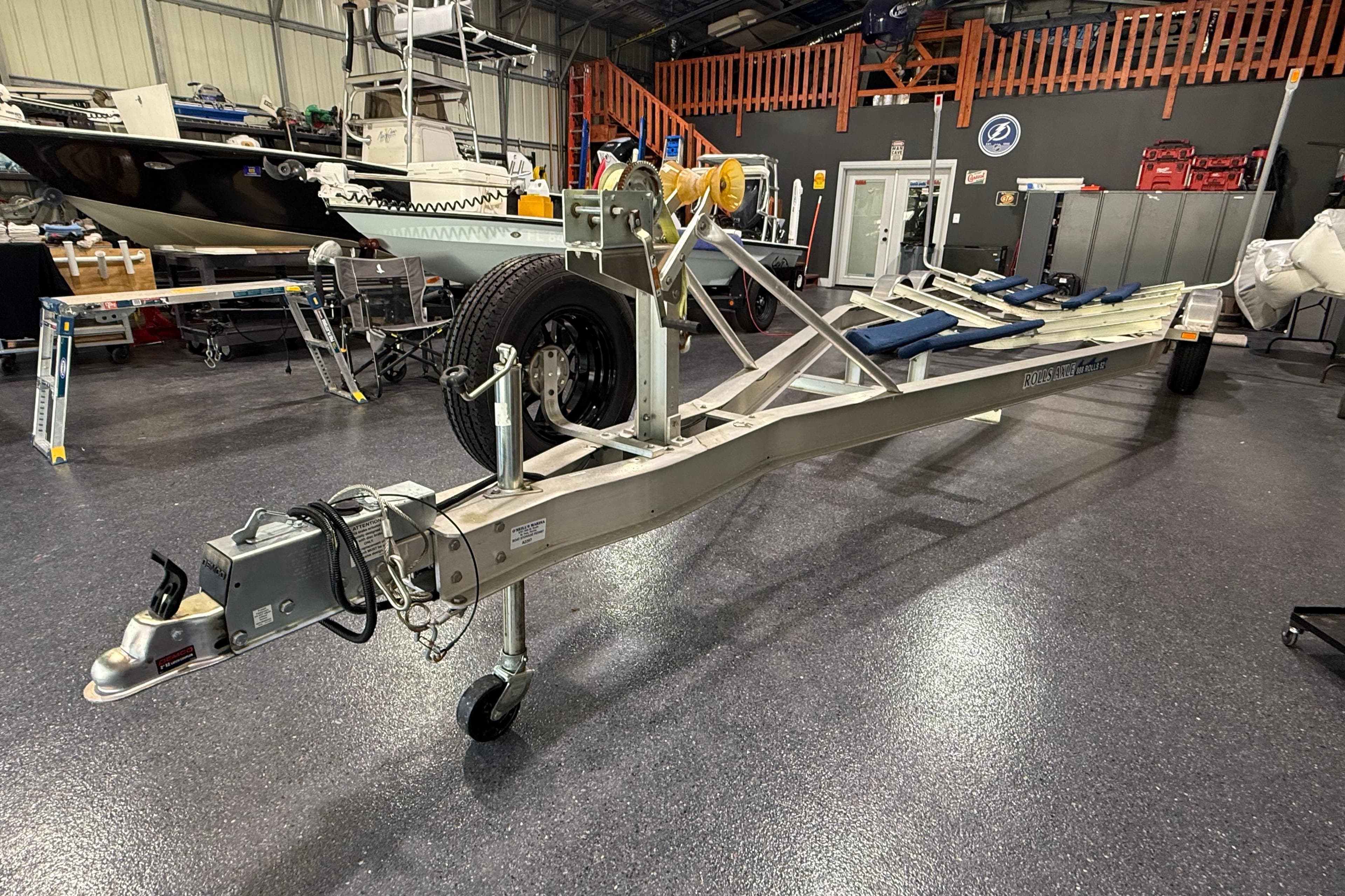 Boat trailer in a garage, designed for 2024 Contender 26 Bay model.