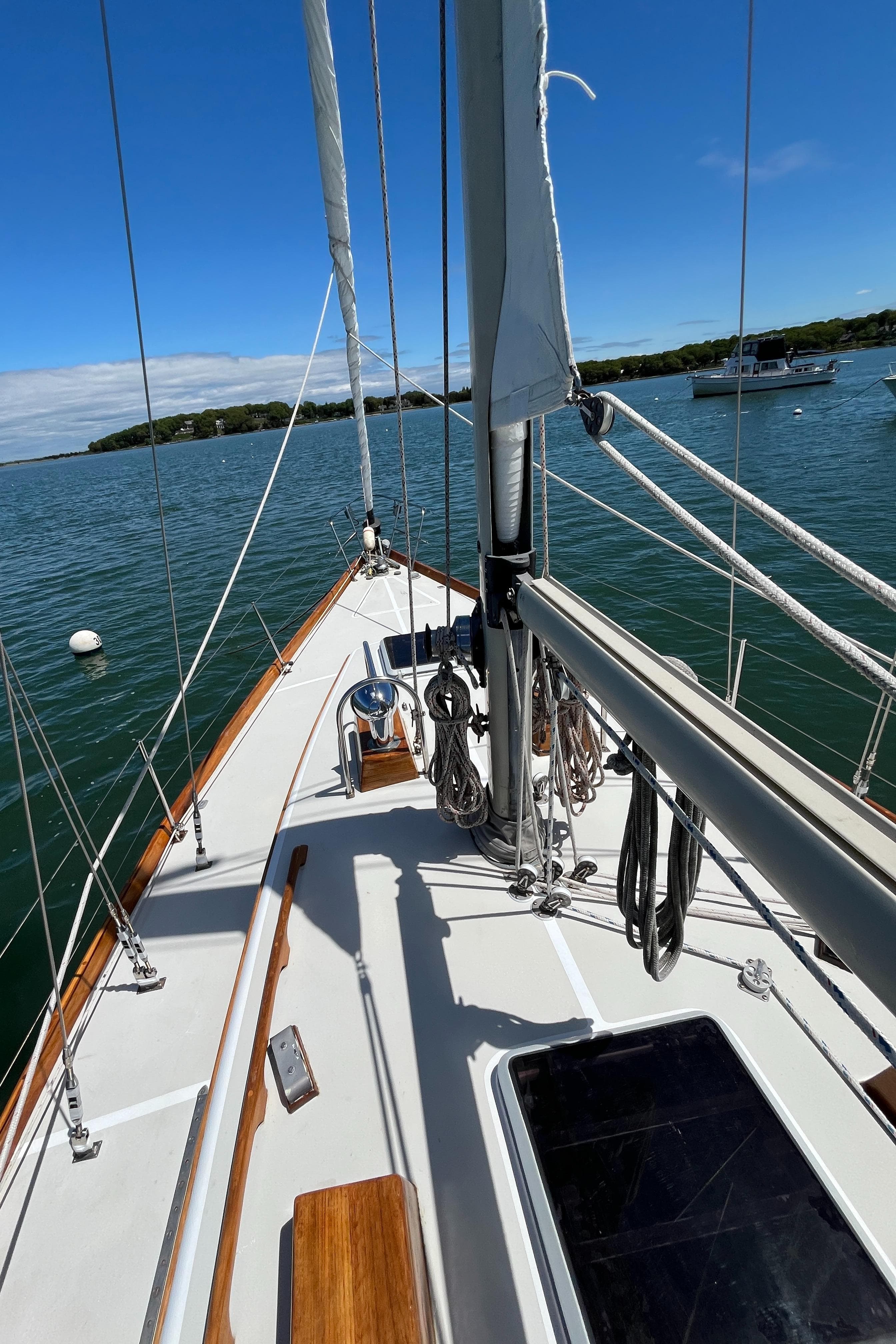 1986 Bristol 38.8 sailboat deck with clear skies and calm waters.