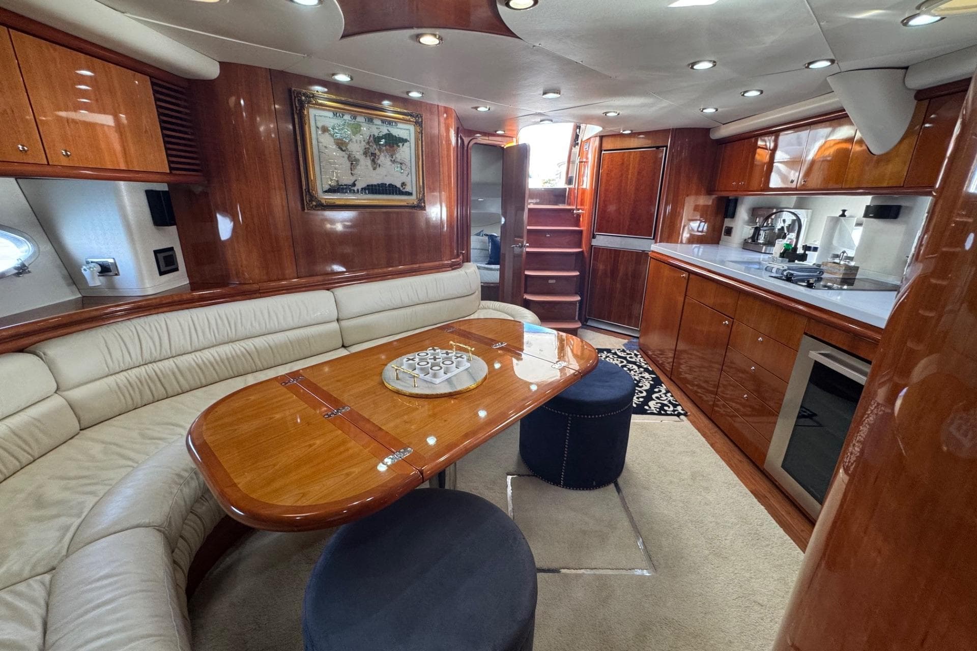 Luxurious interior of a 2000 Sunseeker Predator 56 yacht with elegant wood finishes.