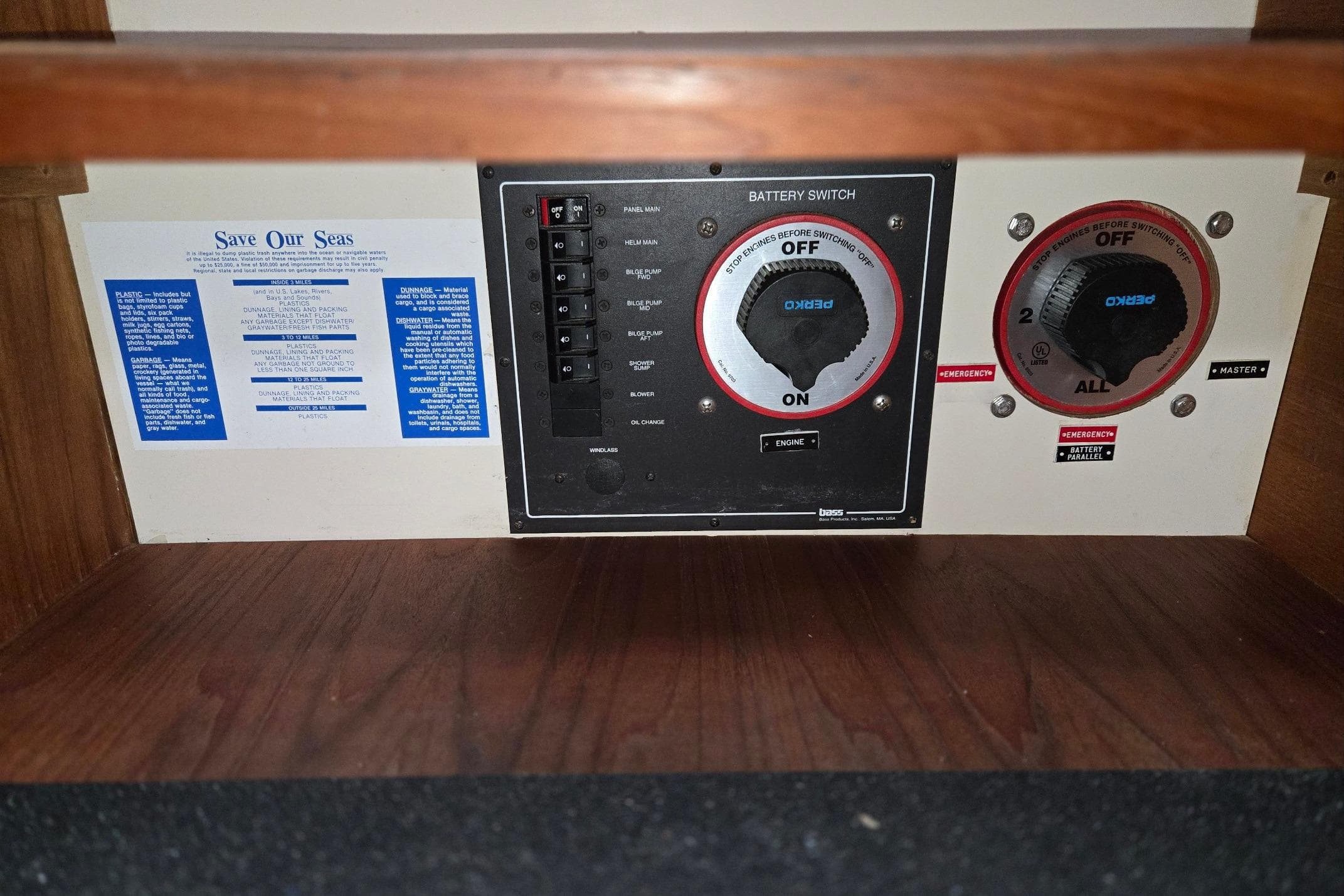 1998 Mainship Pilot 30 control panel with battery switches and environmental notice.