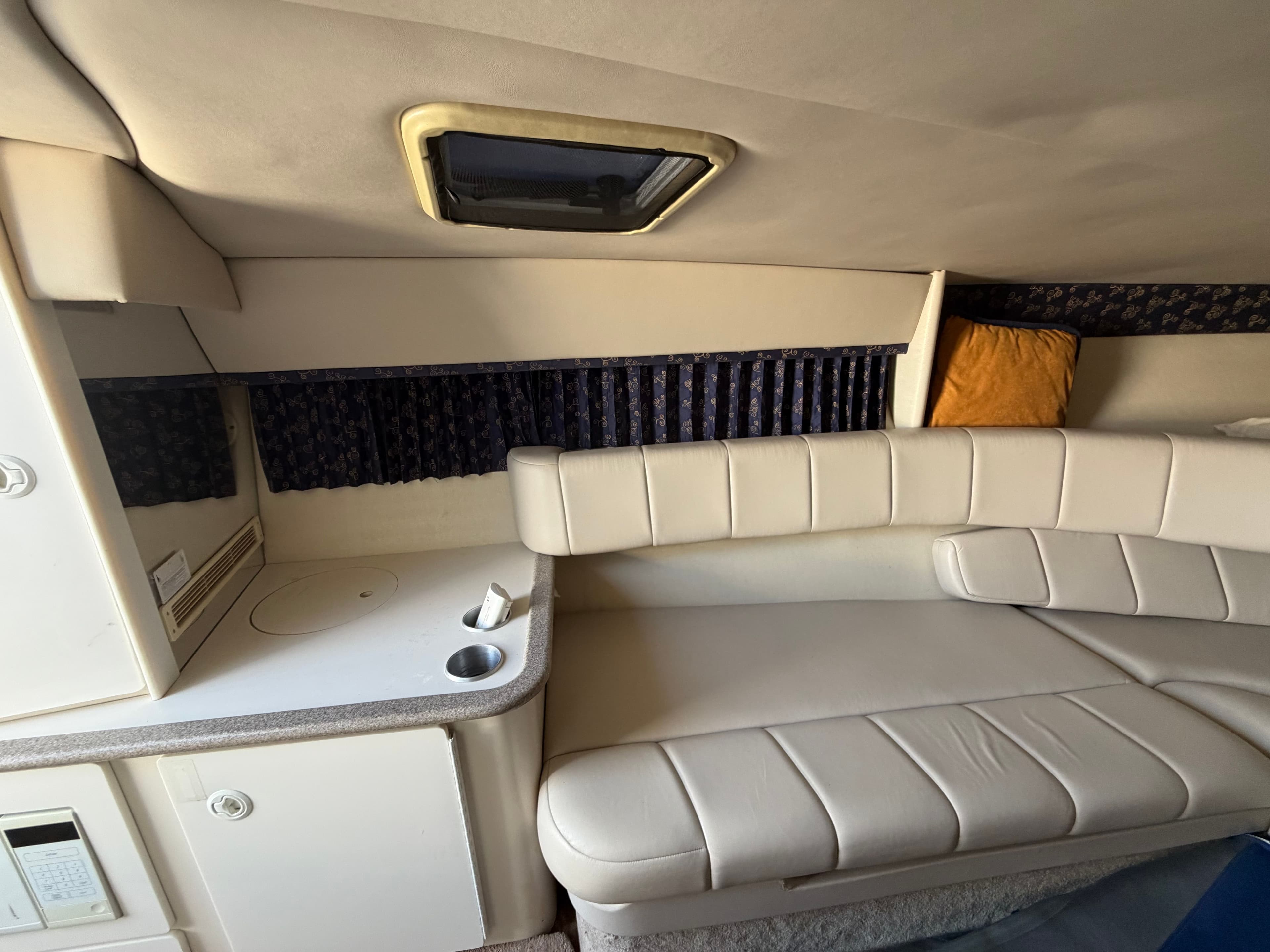 Interior of 2002 Formula 330 Sun Sport with leather sofa.