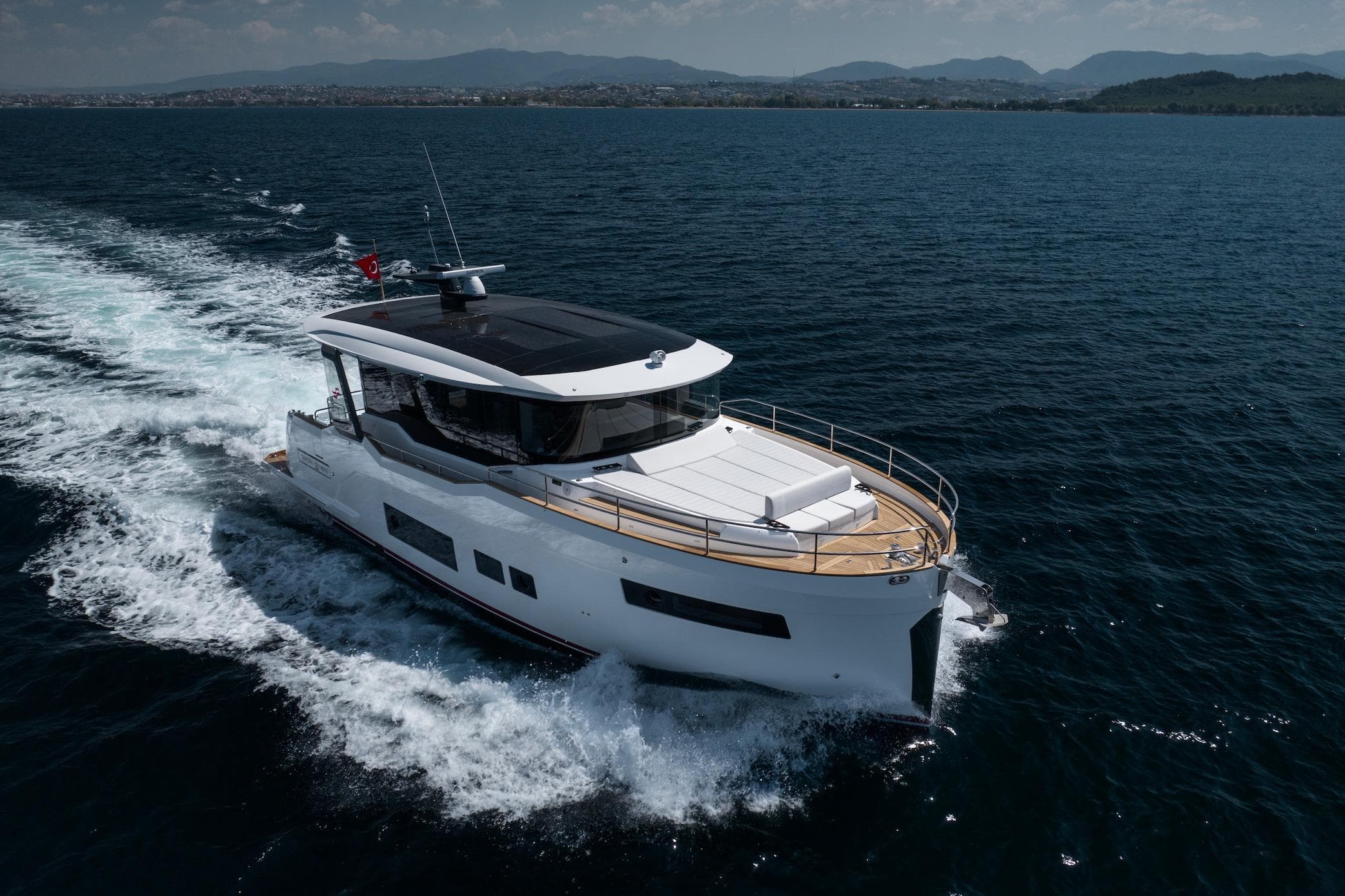 2026 Sirena 48 Coupe yacht cruising on open water, showcasing sleek design and luxury.