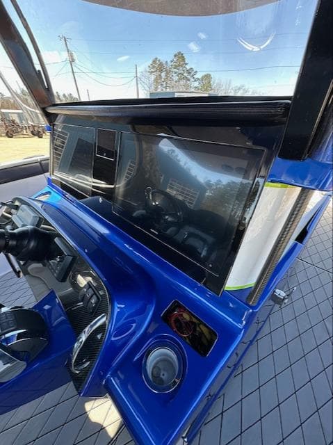 2019 Mystic Powerboats M4200 dashboard with sleek blue design and advanced controls.